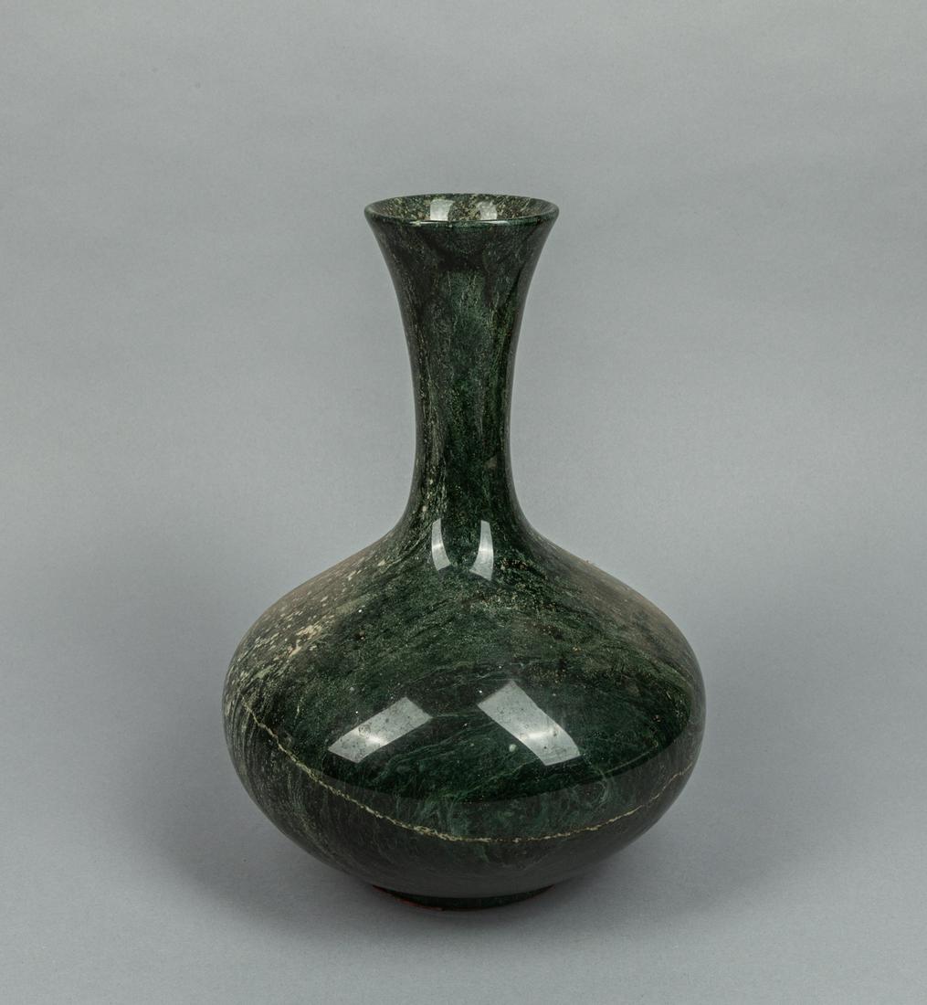 Louis XV Style Marble Carved Vase: Decorative marble vase in black tone with white inclusions, of compressed globular form rising to a waisted neck and flaring rim. 8.2*11.4inch. The body incised with hairlines.