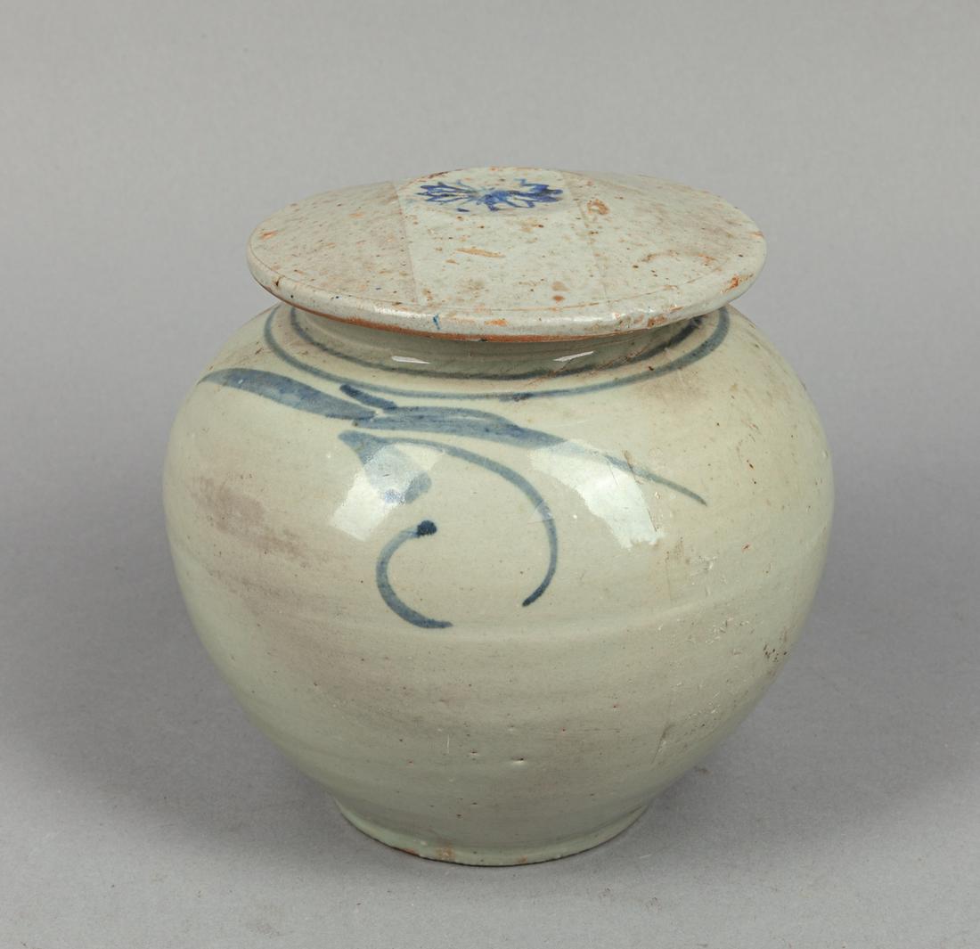 Korean Blue White Porcelain Jar: Of ovoid form, the body and cover decorated with floral patterns in blue tone. 6*6inch.
