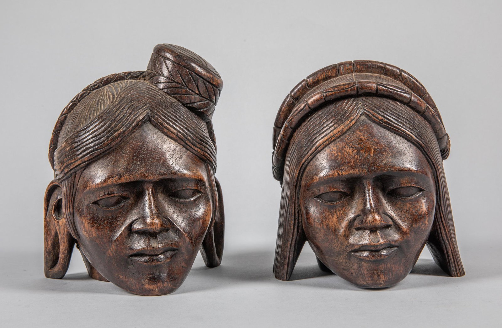 Pairs of North Africa Carved Wood Bookends: Collectible carved North Africa wood figure. 7 inch H; 5.5 inch W. (largest). The estate of Ira Morrison, Beverly Hills, CA.