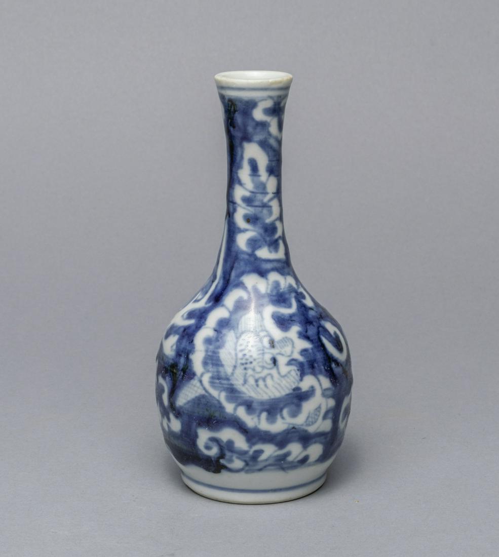 Chinese Blue & White Porcelain Cabinet Vase: The body painted with a dragon amidst clouds, base incised with a shou character. 6.2*2.9inch.