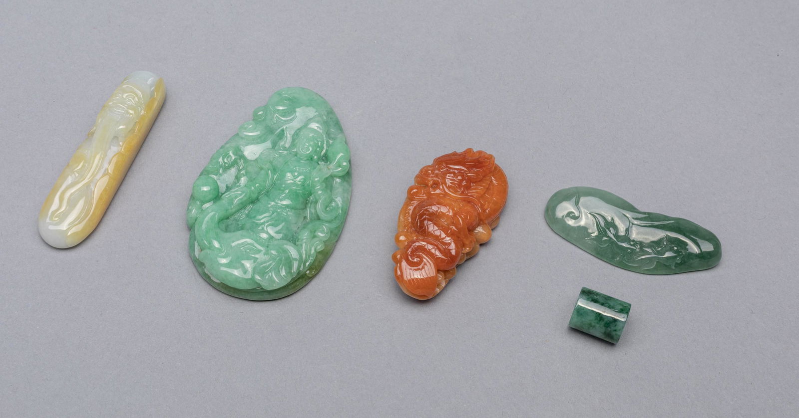 Set Chinese Jade Jadeite Stone Carvings: Group of five Chinese jade jadeite stone carvings, carved with dragon, buddha, elephant, goldfish and figure. 2.8*1.7inch (largest).