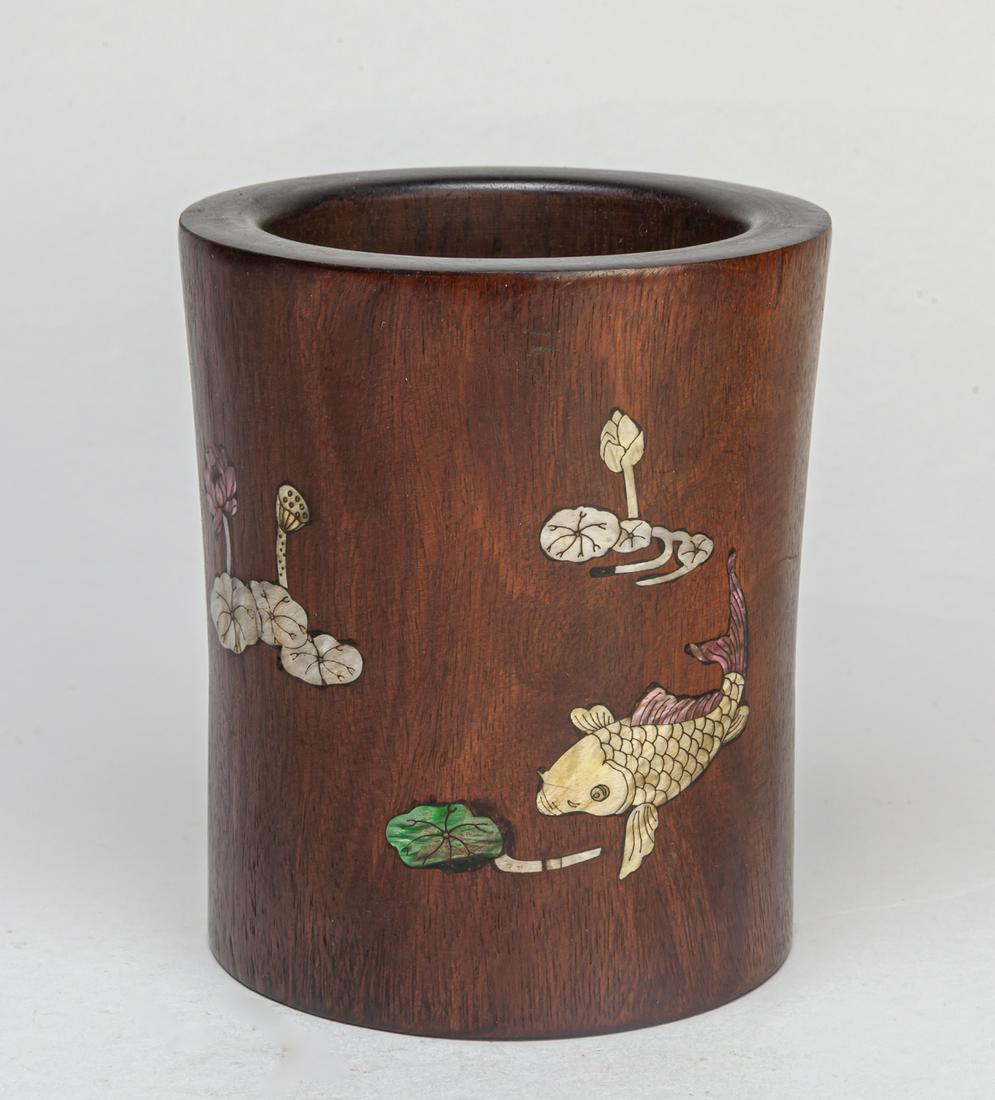 Chinese Wood Inlaid MOP Brush Pot: The exterior decorated with lotus and fish patterns and inscribed related passages with mother of pearl inlay, base pieced with a cork. 5.3*4.6inch.