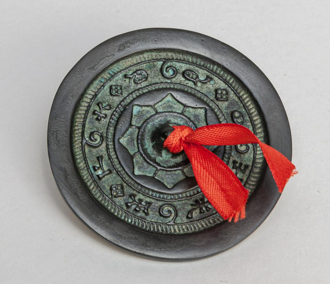 Chinese Bronze Mirror: Cast with floral and traditional motifs, then central with a pierced knob, the mirror face polished. 2.8inch D.