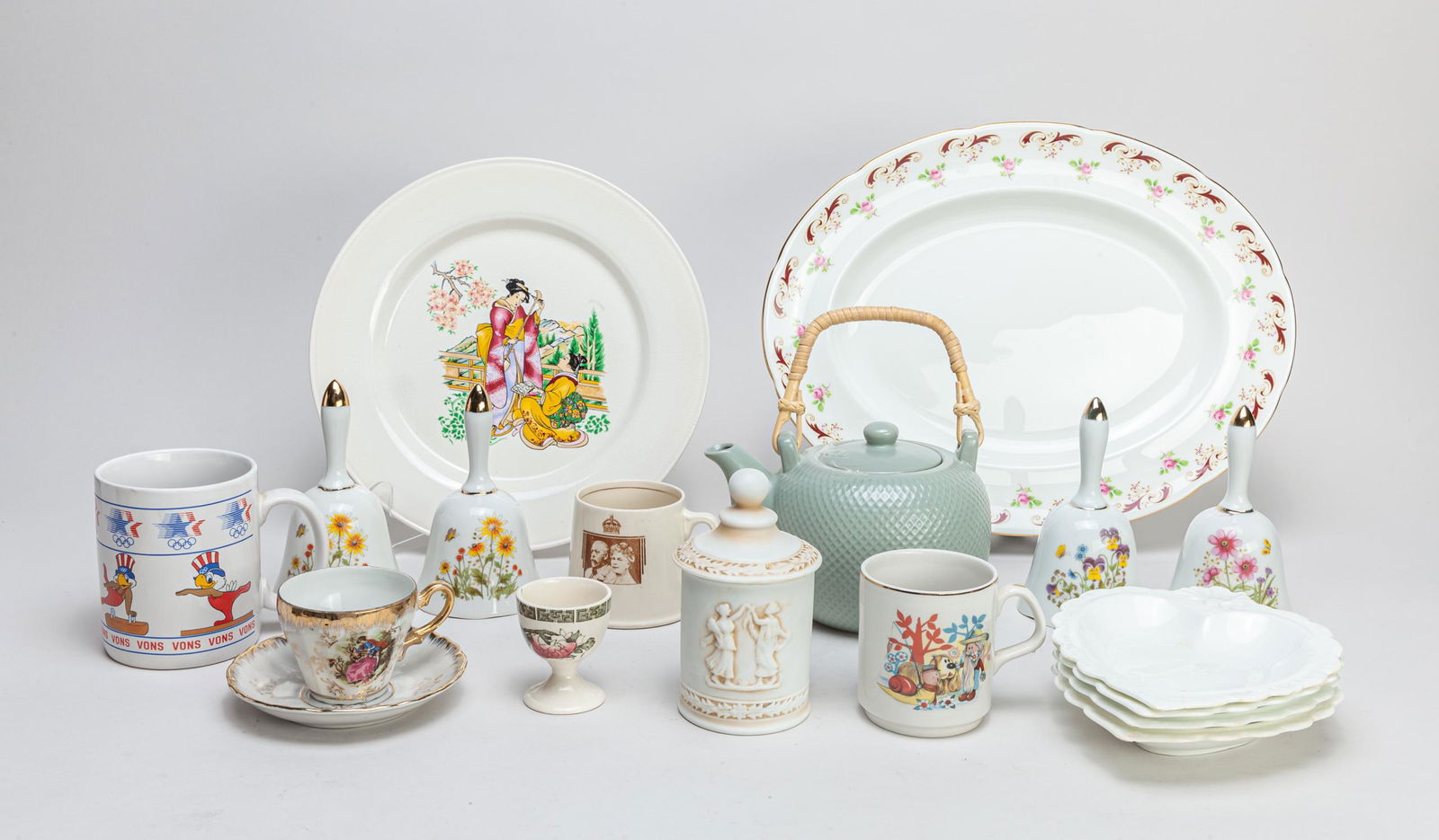 Set Estate Porcelain Wares: A large group of enameled porcelain pieces, Including plates, cups, mugs, bells, covered jar and tea pot. 13.8*10.7inch (largest).
