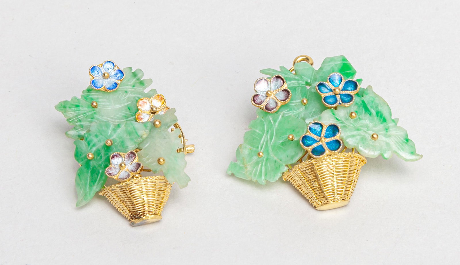 Pair Chinese Jadeite & Gold on Silver Brooch: Collectible brooches designed in form of enameled flowers and jadeite leaves in gold on silver baskets. 1.4*1.3inch (largest).