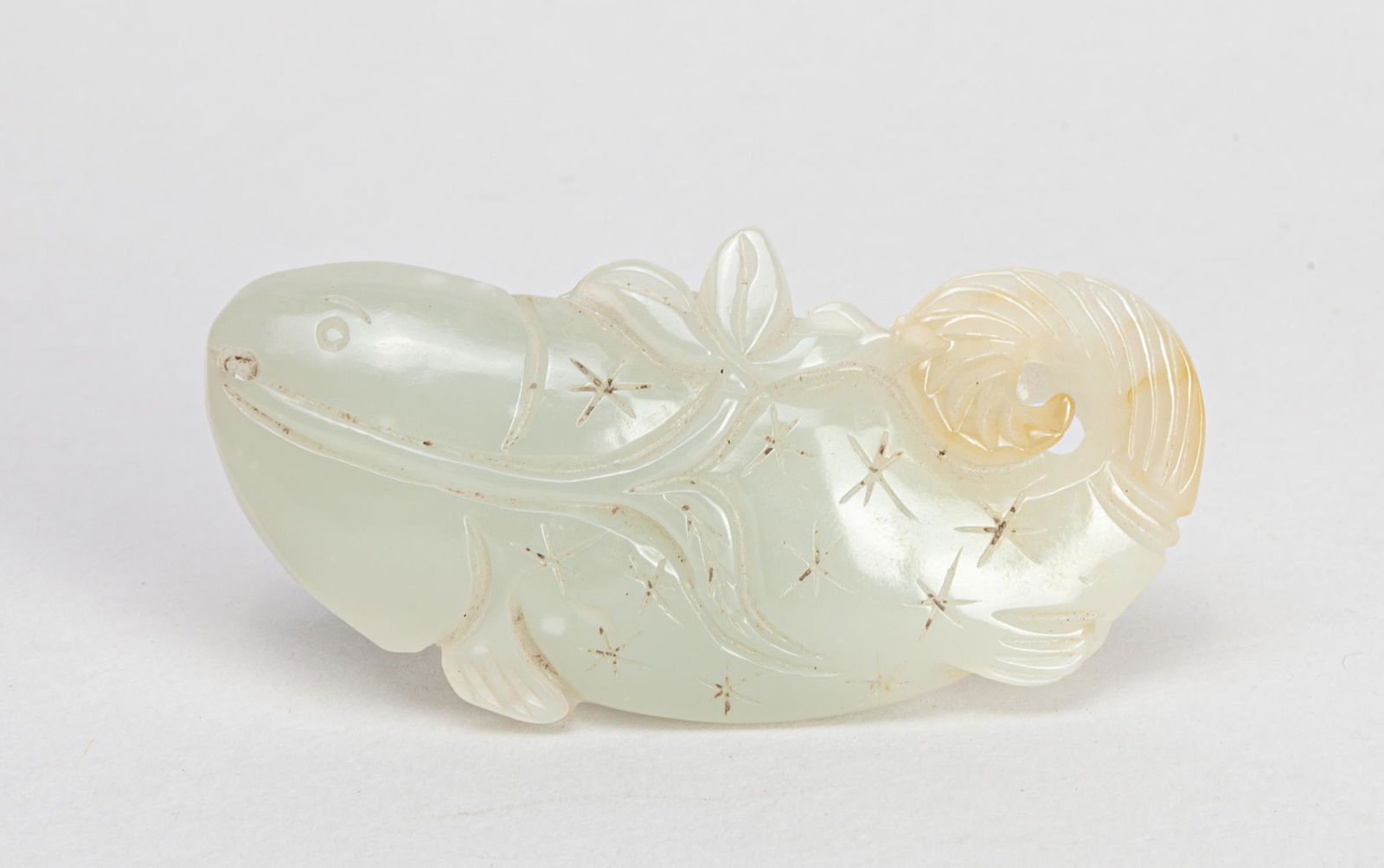 Chinese Jade Toggle of Fish: Soft gray jade carved as fish carrying a leaf stem. 2.8*1.3inch.