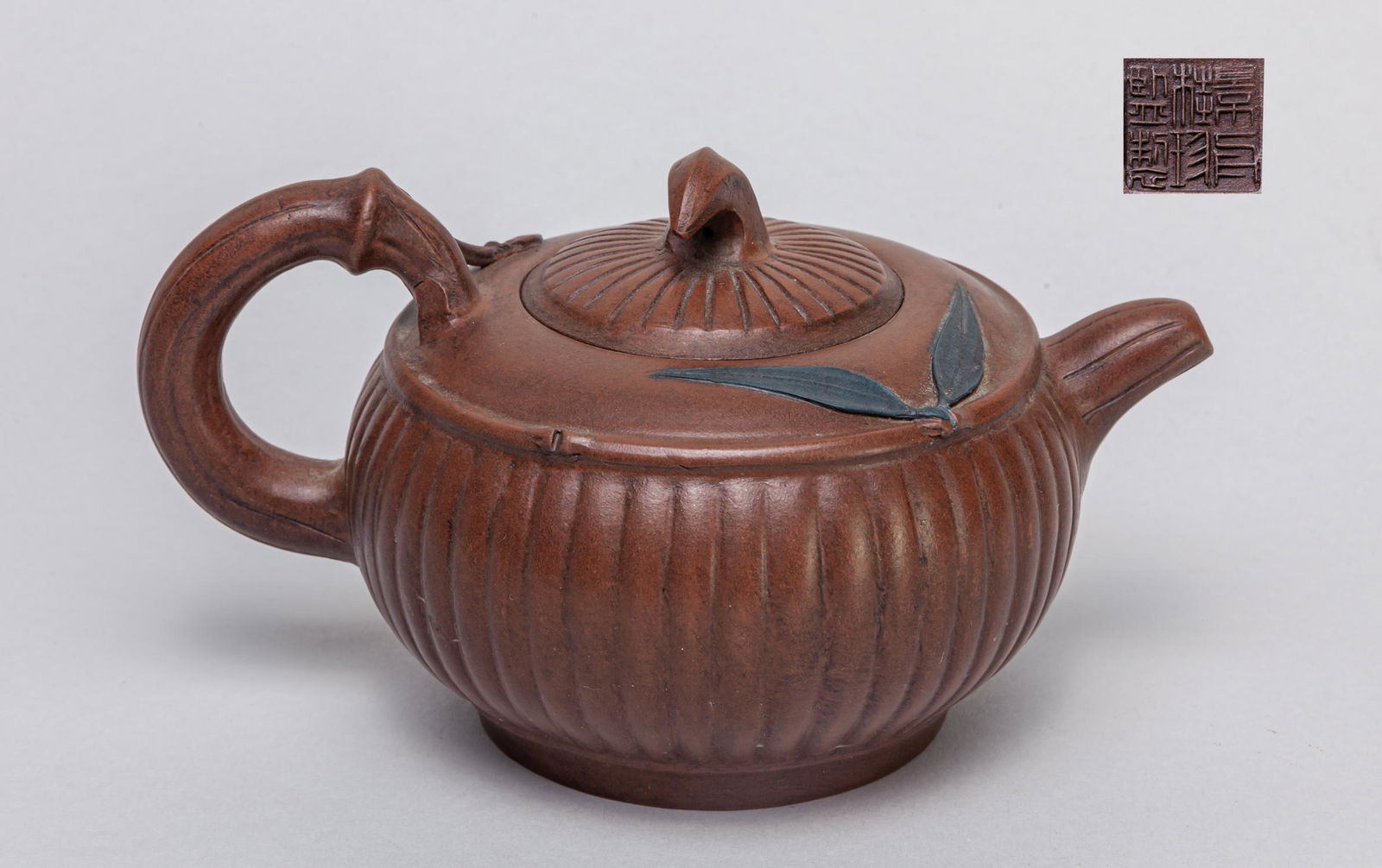 Chinese Yixing Zisha Tea Pot: Overall carved with bamboo patterns, either the cover interior and base with a seal mark. 6.2*4.4*3.7inch.