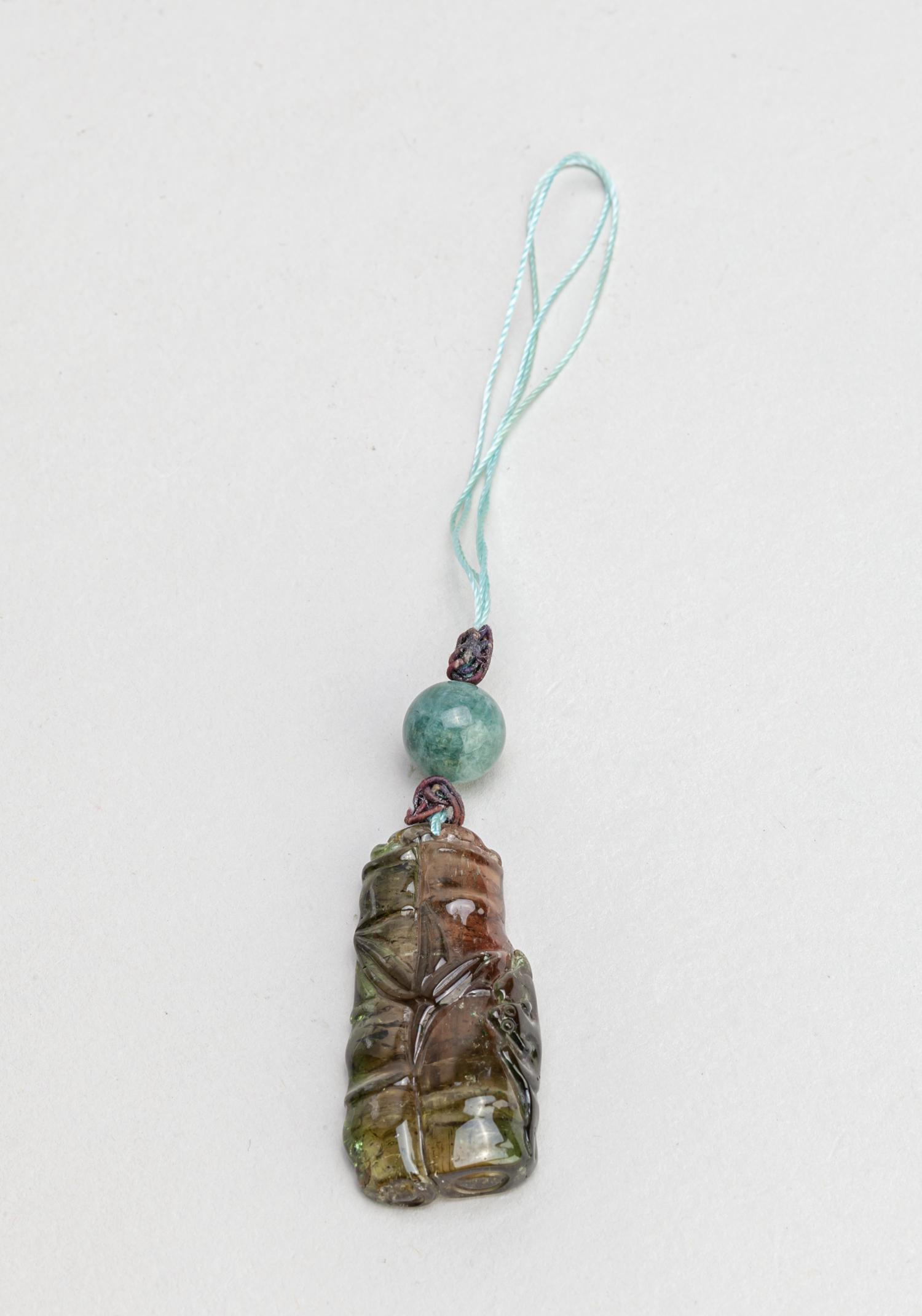 Manchu China Tourmaline Toggle: Tourmaline toggle carved as bamboo and bat, tourmaline is crystalline mineral compounded with elements such as aluminum, iron, magnesium, sodium, lithium, or potassium. 1.7inch L, 0.8inch W (toggle on