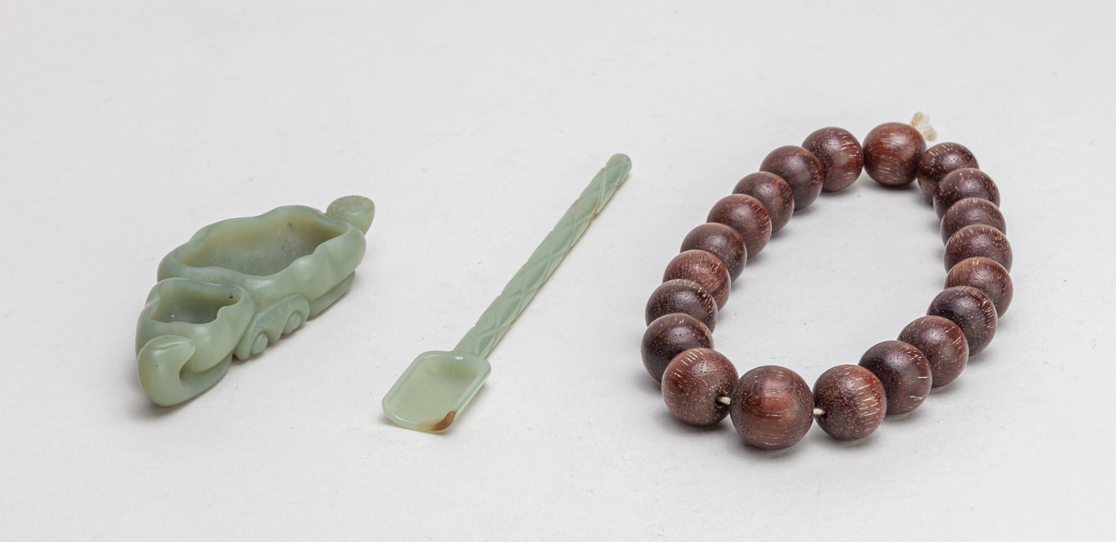 Estate Chinese Beads & Jade: 3 pieces in total, Including wood beads, a jade hair pin and a jade washer carved in lotus form, the stone of pale celadon color. 13inch L (largest).