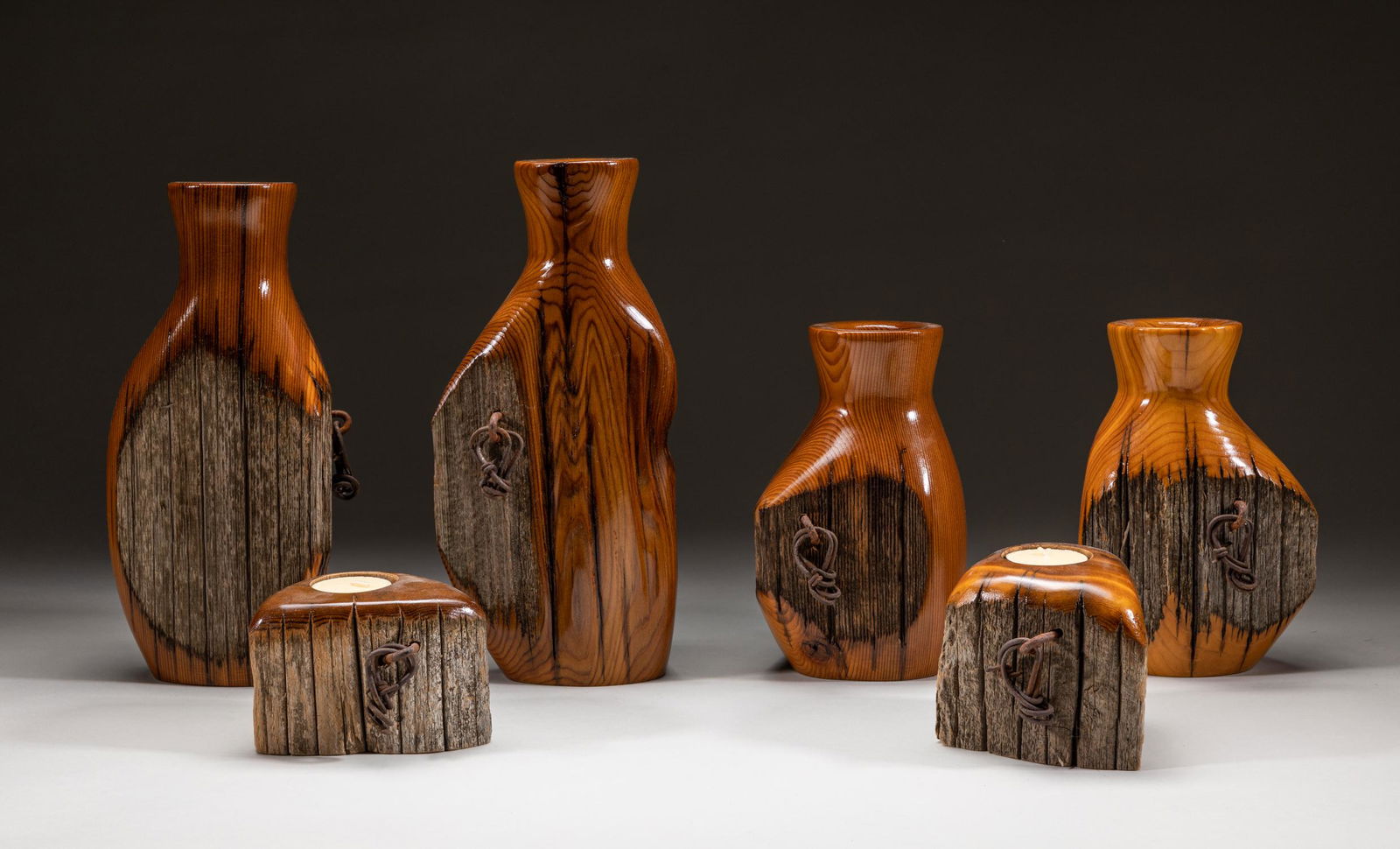 Designed Art Wood Vase & Lamp: Group of art wood cases, lamps and candleholders, carved and modeled in rough wood trunk form.10.5inch H, 5.1inch L, 3.5inch W.