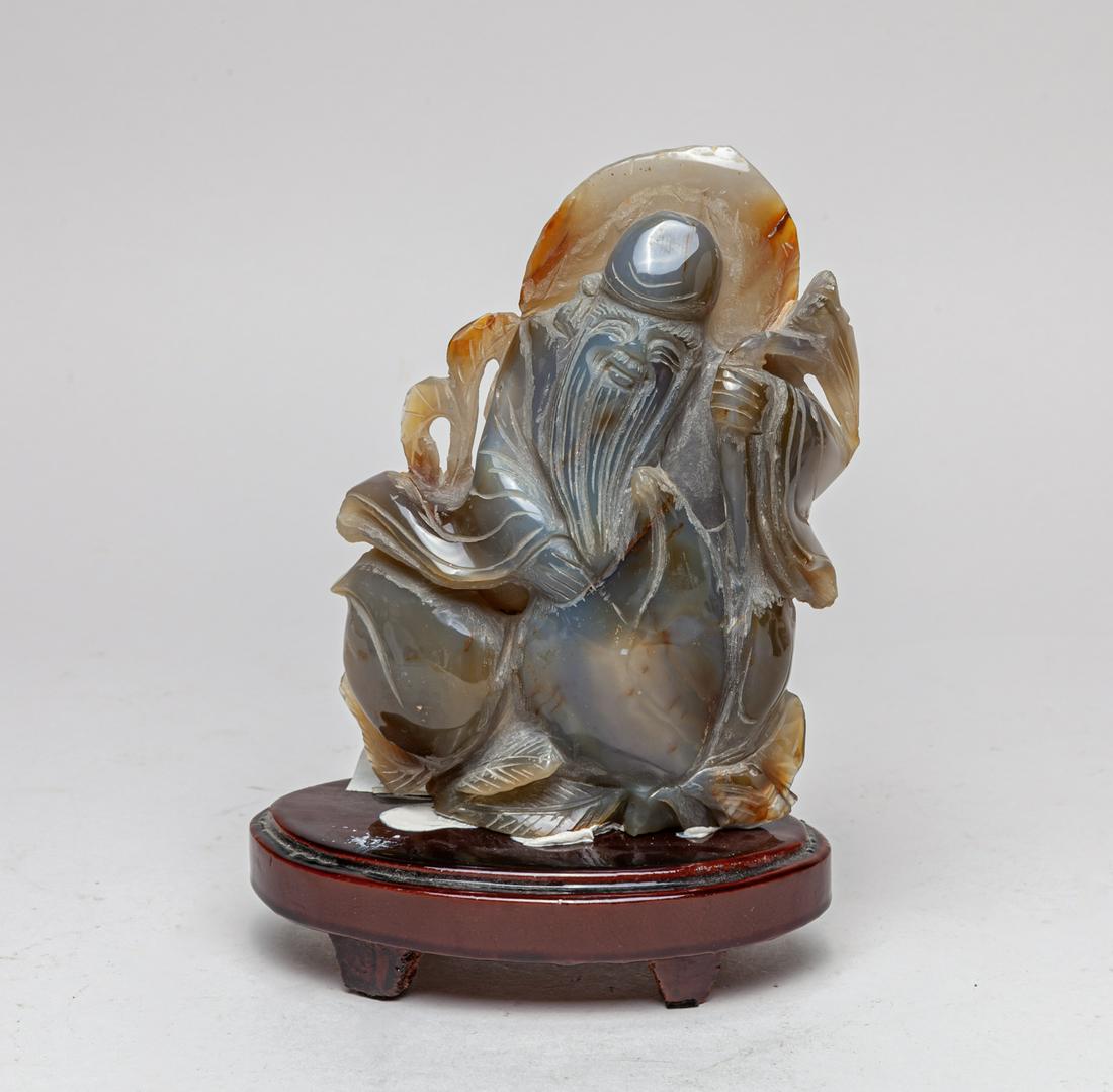 Chinese Export Cameo Agate Shoulao: Depicting the immortal shoulao with a benevolent expression on his face framed by raised forehead and long, finely-incised beard, dressed in flowing robe with ample sleeves, his left hand holding a st