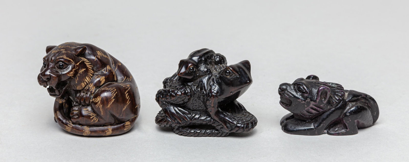 Estate Japanese Signed Wood Netsuke: Group of three collectible Japanese type wood netsukes, well carved in form of tiger or toad, wherein two base with signed mark on base. 1.4inch L, 1.4inch W, 1.3inch H (largest).