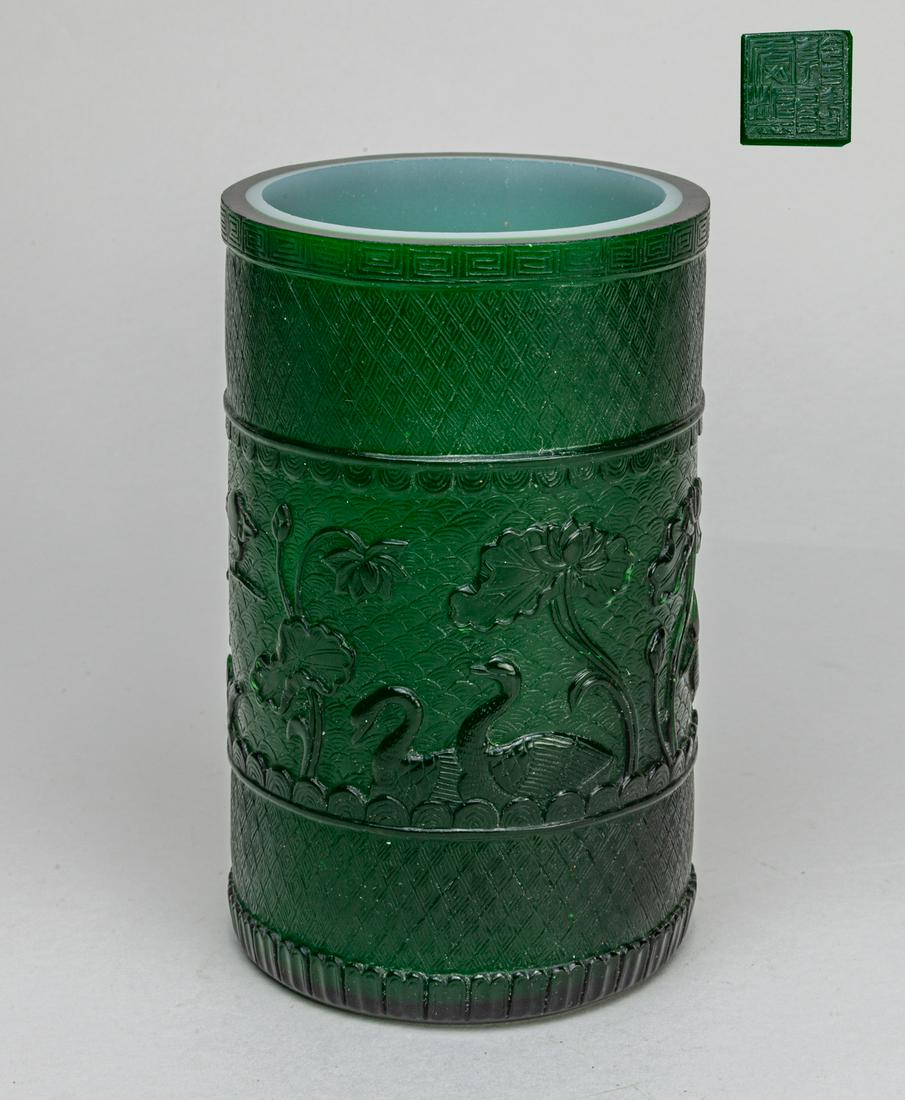Chinese Overlay Glass Brush Pot: The exterior carved with a band of lotus, cranes, ducks, and fish between fret patterns on green ground, base incised with a seal mark. 6.2inch H, 3.9inch D.