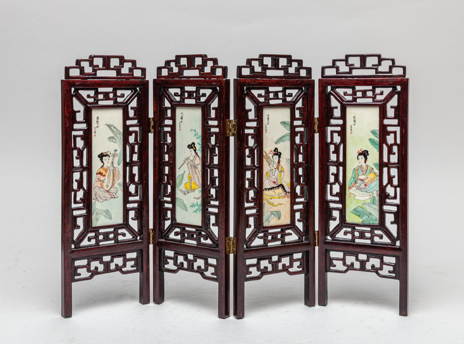 Chinese Wood Table Screen Inlaid Bone Like Carving: Collectible four-panel wood table screen, each panel with a rectangular bone like inlay painted with beautiful ladies playing traditional instruments and inscribed with related passages. 14.7inch W, 1