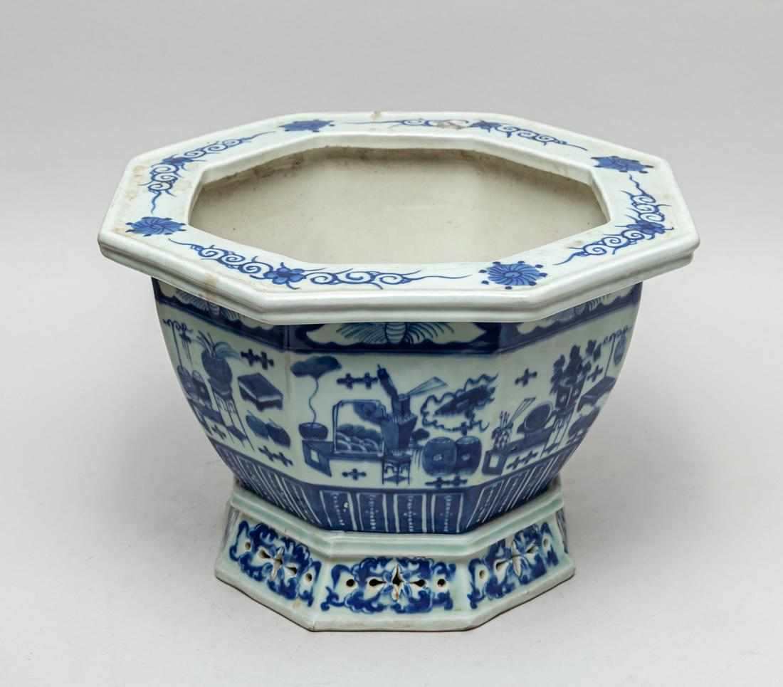 Chinese Export Blue & White Porcelain Pot: Of octagonal section, each side decorated with scholar â€˜boguâ€™ patterns between a bat and upright lappets, the flattened rim with foliate scrolls, the spreading foot and the base centre pi