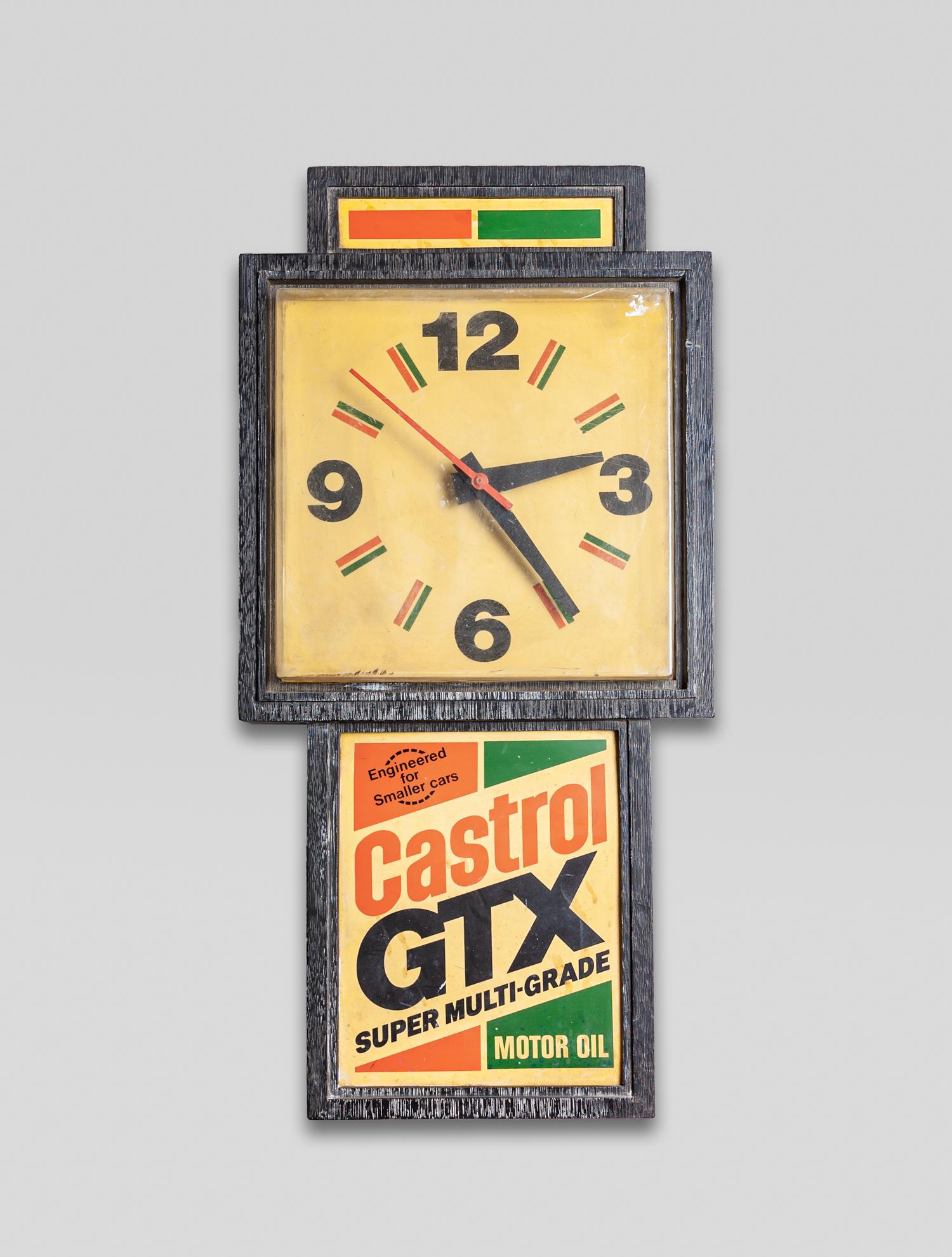 Vintage Castrol GTX Clock Sign: Vintage style framed advertising Castrol GTX Motor Oil clock sign, with cable. 24inch H, 11.6inch W, 4.2inch L.