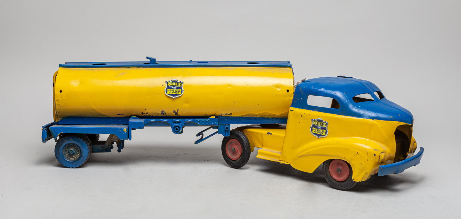 Massive Metal Die Cast Toy Car: A large collectible metal die cast toy car painted in yellow and blue, marked Richfield, The Gasoline of Power. 16inch L, 6inch W, 6.5inch H (larger).