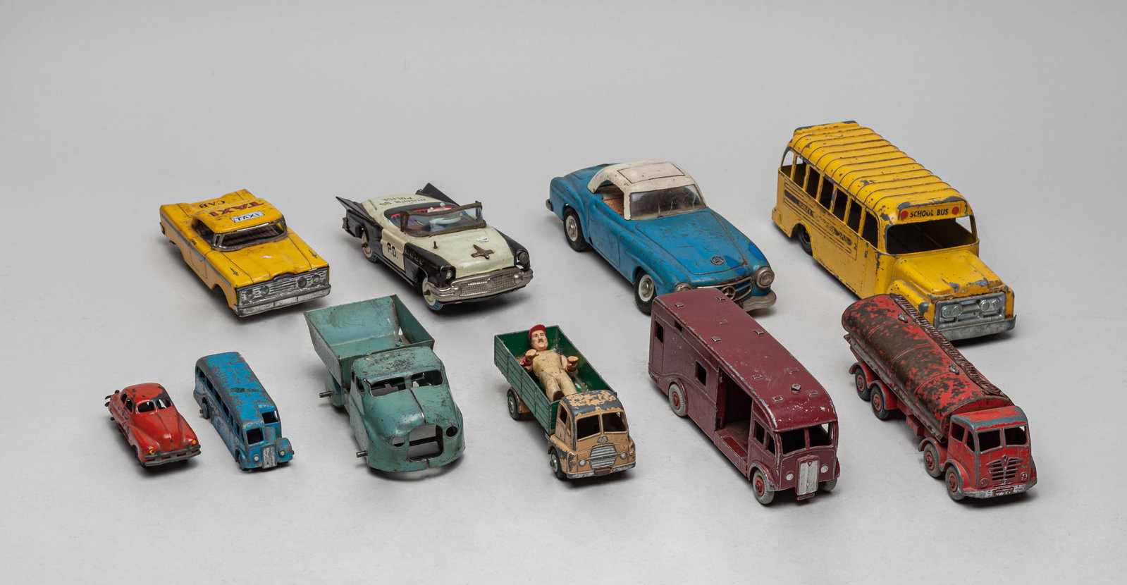 Estate Vintage Metal Die Cast Toy Cars: A large group of collectible vintage metal die cast toy cars, wherein some pieces marked school bus, taxi or P. D. 9.4inch L, 3.2inch W, 2.8inch H (largest).