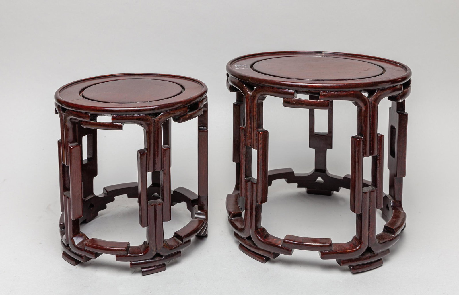 Chinese Rosewood Stand Sets: Two pieces as a group, all of rounded section, the aprons and legs carved in Chinese traditional form. 8.6inch D, 8.1inch H (larger).