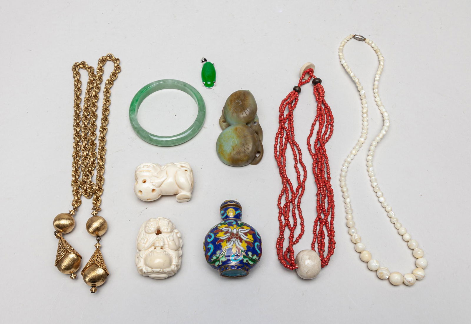 Collectible Chinese Jade, Jewelry & Decors: Including two bone carvings, a jade carving, two bead necklaces, a cloisonne snuff bottle with stopper, a golden color chain decor, a bangle and a pendant. 32inch L (largest).