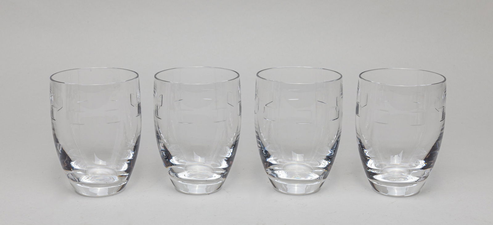 Set Waterford Crystal Glass Cup: Set of four collectible clear crystal glass cups, the base marked John Rocha Waterford. 4.5inch H, 3.3inch D (each).