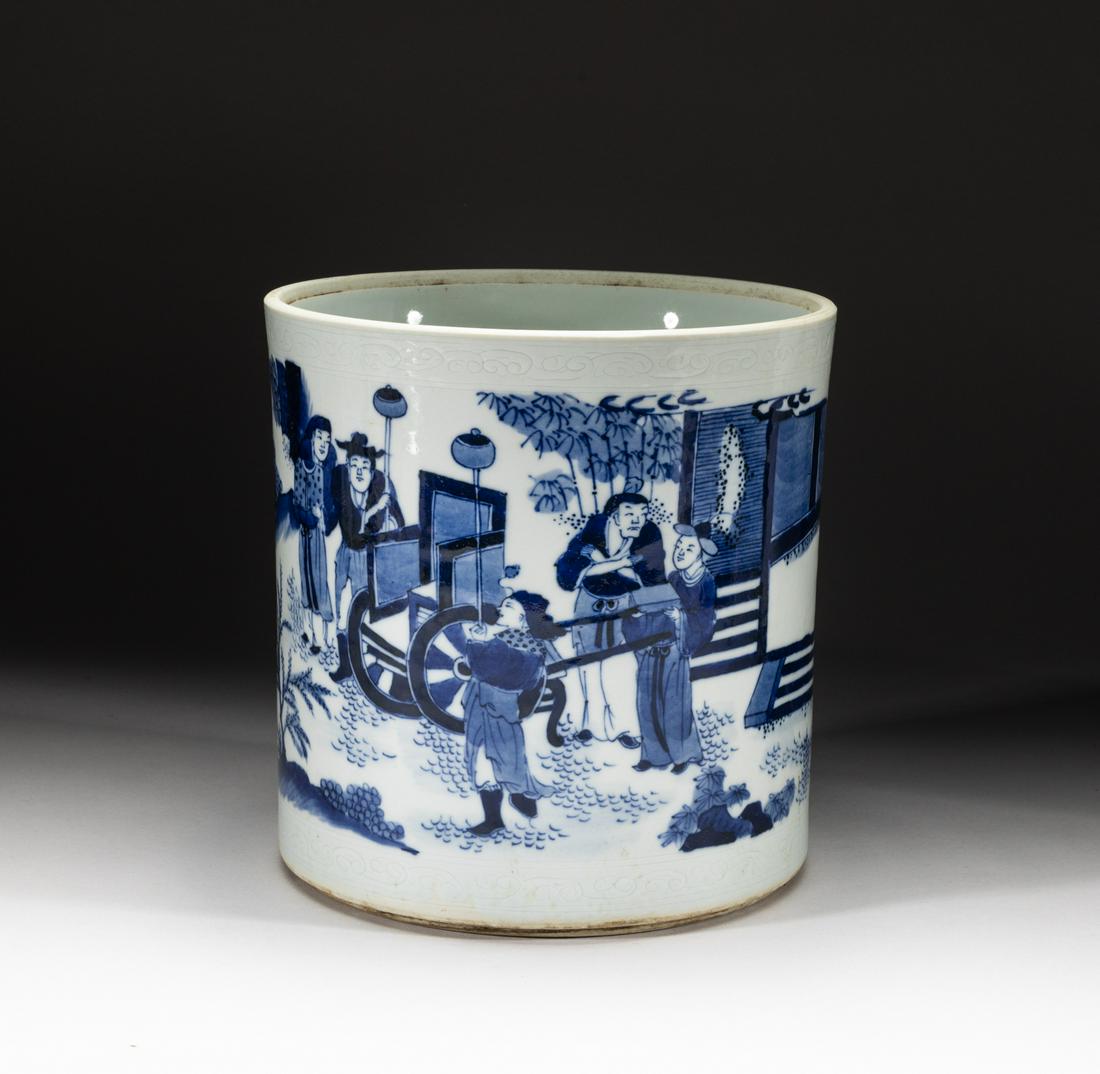 Chinese Bright Blue & White Porcelain Brush Pot: Of cylindrical form, painted around the exterior with a scene of nine figures in various activities amid rockery, trees and bamboo, the rim incised in low relief with clouds patterns, the unglazed bas