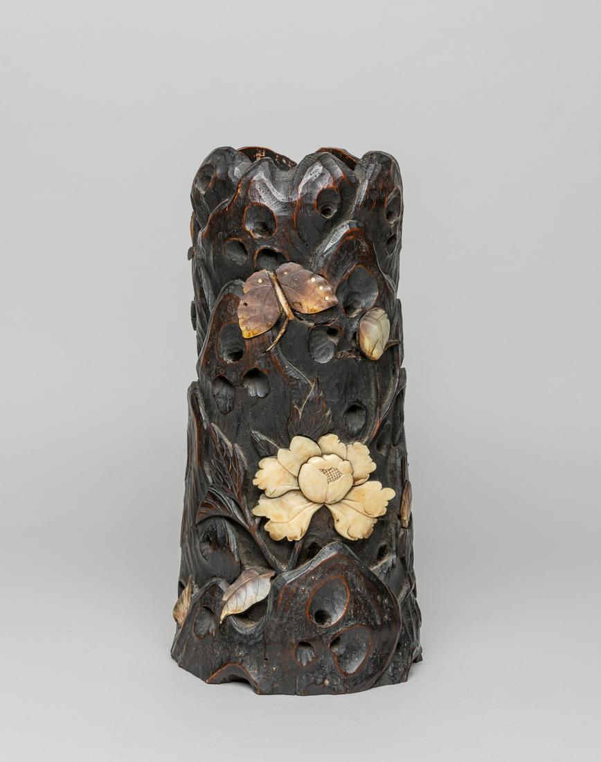 Japanese Wood Inlaid Gem Stone Pot: Collectible Japanese wood pot carved with rock work in multiple layers of relief, with mother of earl and bone inlay worked as a butterfly and flowers. 11.8inch H, 6.2inch W.