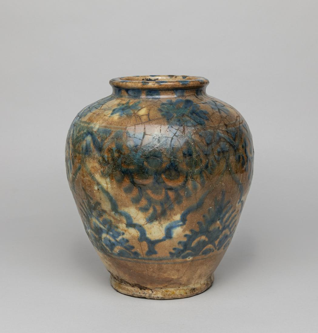 Repaired Korean Blue White Porcelain Jar: The ovoid body painted with stylized flower patterns on a crackled ground, the base pierced with an aperture. 9.7inch H, 8.5inch D.