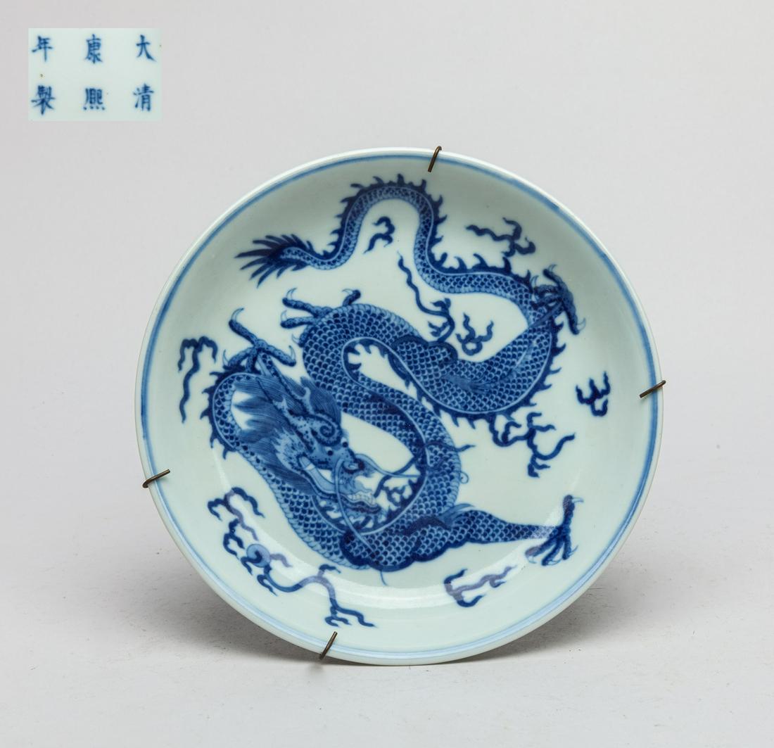 Chinese Blue & White Porcelain Dragon Plate: The interior vividly painted with a four-clawed coiled dragon chasing a flaming pear among flames, the exterior with three lingzhi and the base marked with six characters. 7.6inch D. The Estate of Lin