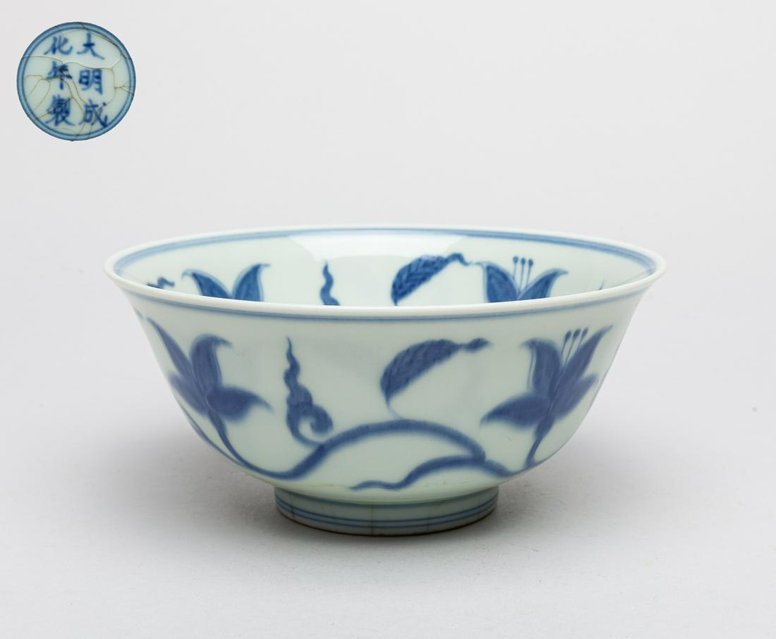 Chinese Blue & White Porcelain Bowl: The interior central painted with a lotus bloom enclosed in double circles, the sides with meandering lotus sprays around the inside and out, the crackled base marked with six characters. 6.2inch D, 2