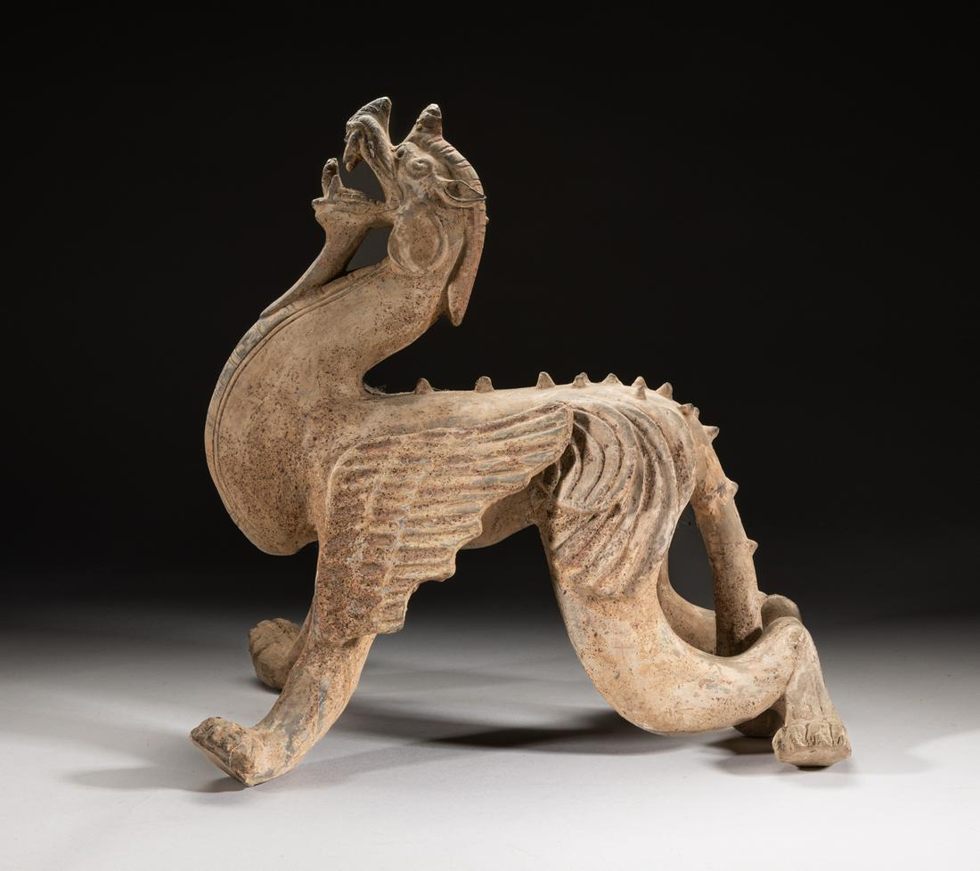 Repaired Large Korean Pottery Beast: Rare large pottery beast, modeled as a standing mythical beast with upright front paws and bending rear legs, the long neck supporting its head looking upwards, the mouth agape baring the teeth and to
