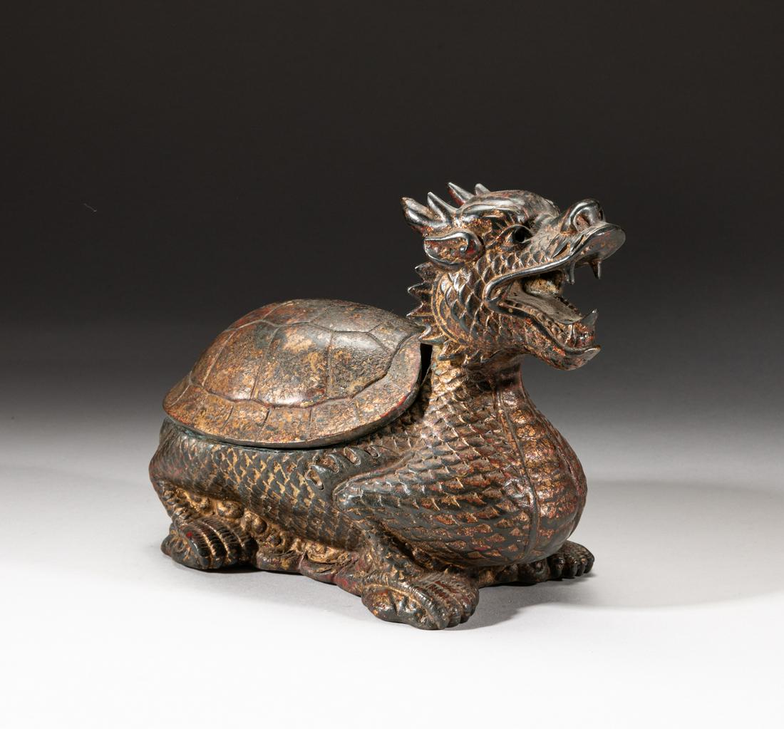 Korean Gilt Bronze Turtle Dragon Sculpture: Modeled in form of a crouching mythical beast with a dragons head and a turtleâ€™s body supported on four bending legs, the face with ferocious expression and open mouth baring its teeth, the sho