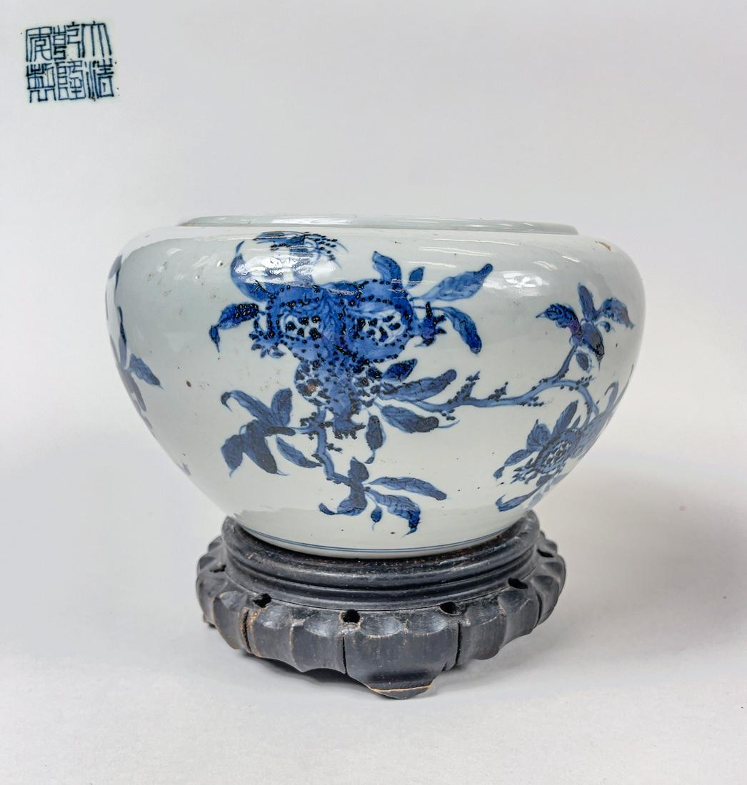 Chinese Blue & White Porcelain Brush Washer: Chinese blue and white porcelain brush washer, decorated with pomegranates, buddha hands and peaches, comes with wood carved stand. 7inch D, 4.5inch H.