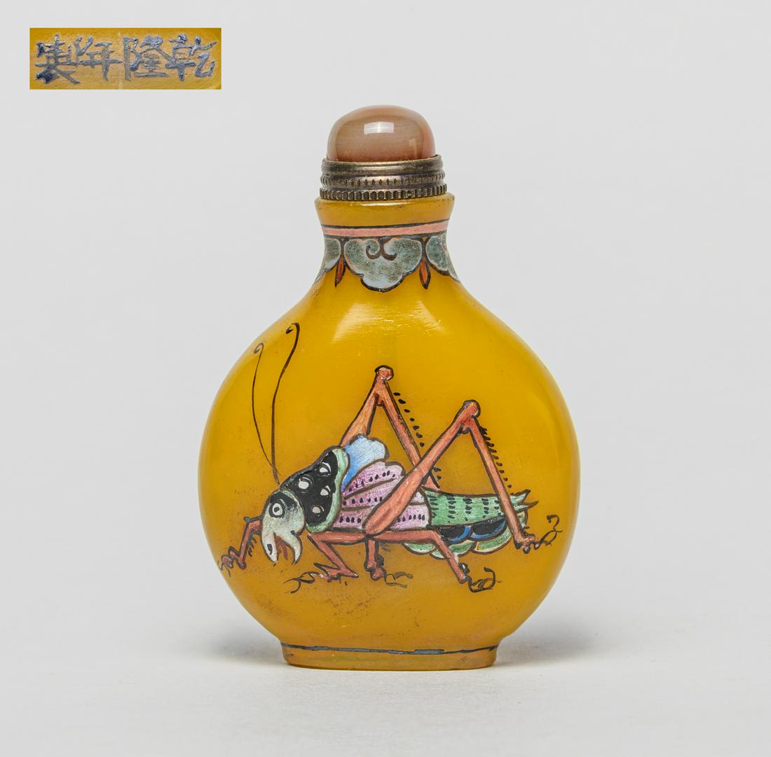 Chinese Royal Type Enameled Glass Snuff Bottle: Of flattened rounded form, each side enameled and painted with a vivid grasshopper below a border of ruyi heads at the neck, reserved on a yellow glass ground, the base marked with four characters, wi