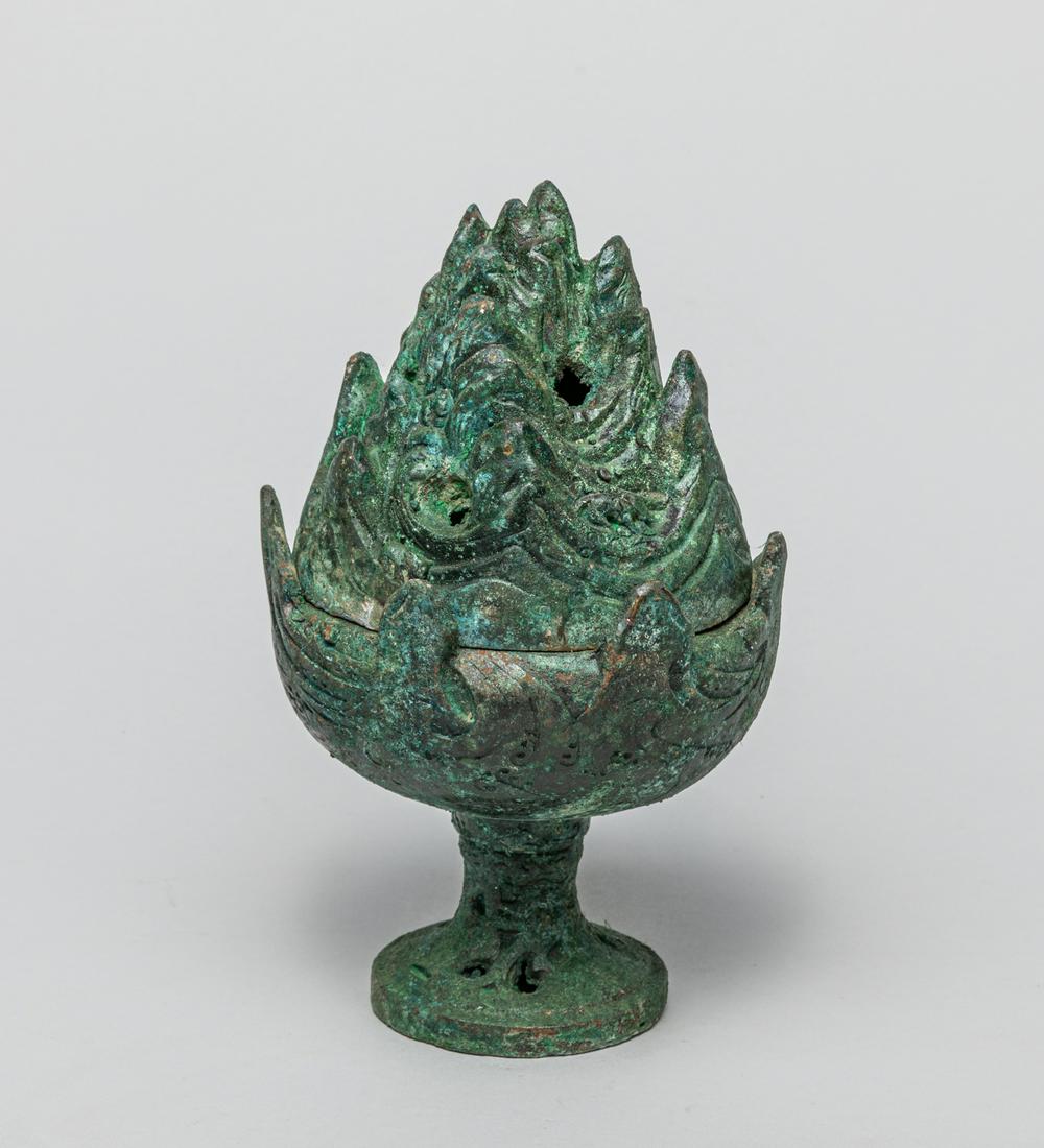 Chinese Bronze Hill Censer: Cast in bud form, the sides of the cover rising in a series of pierced peaks to intimate the beasts and mountains, supported on a hemispherical lower body cast with raised swirling mist. 7.5inch H, 4.