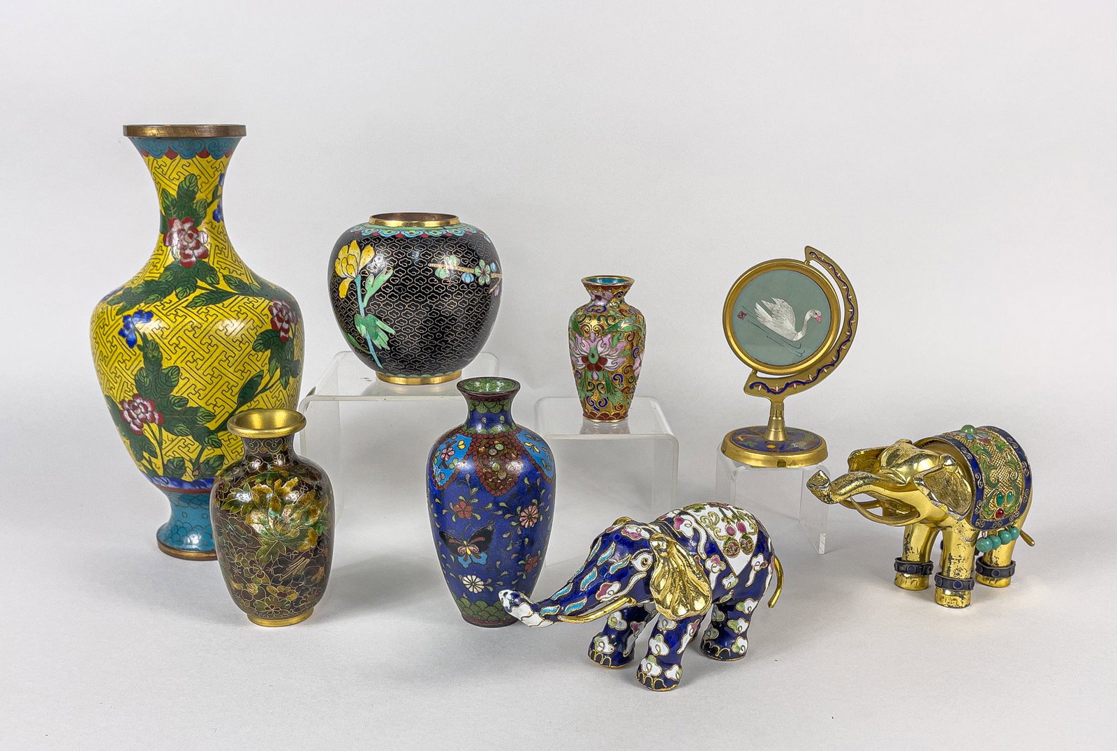 Collectible Chinese Cloisonne Vase & Decors: Group of eight cloisonnÃ© decorative pieces, including three cabinet vases, two elephant sculptures, a jar, a larger vase and an embroidery table decor. 9.2inch H, 4.5inch D (largest).