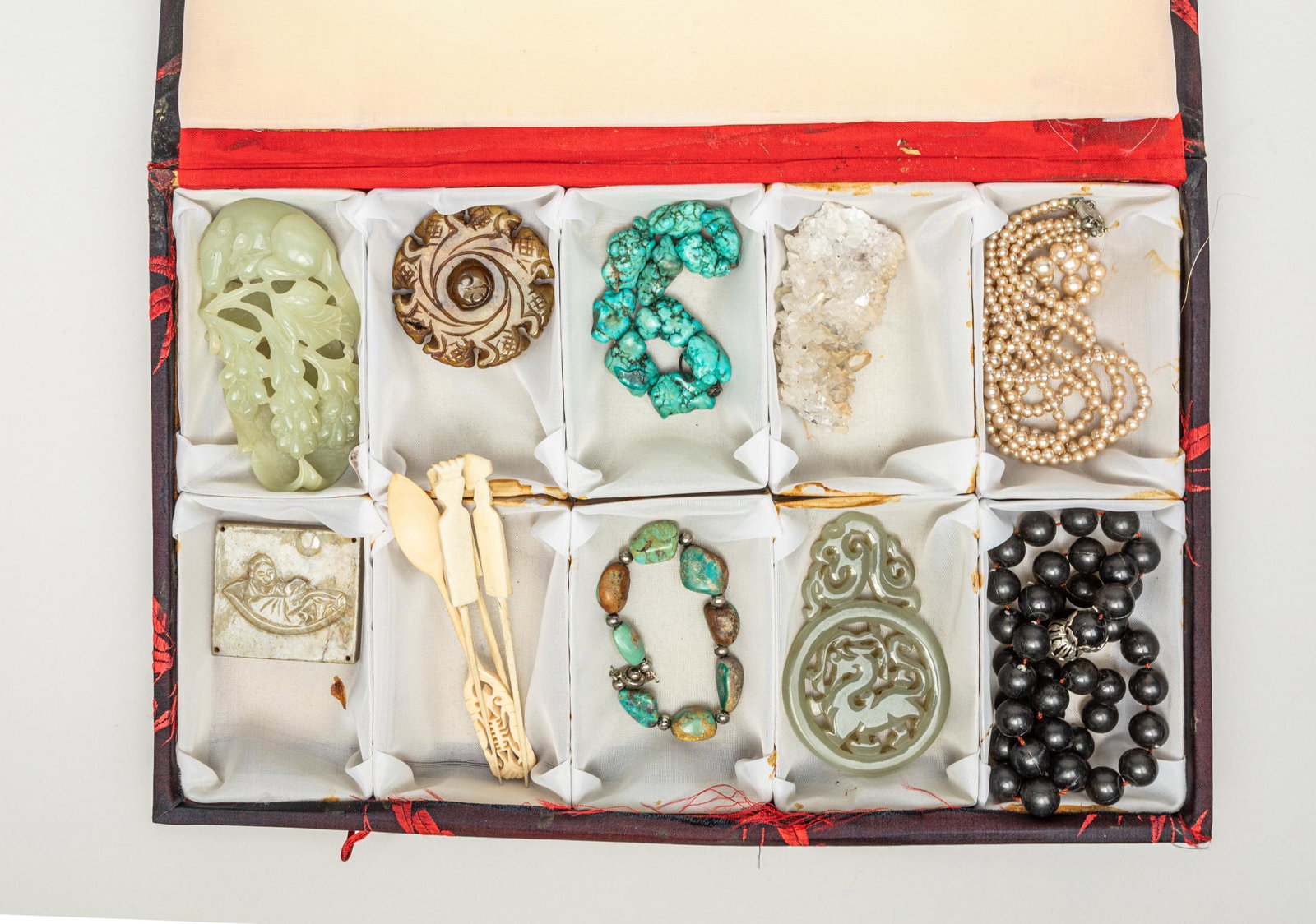 Estate Chinese Jade, Bone & Jewelry: Including two turquoise like bracelets, two decor bead necklaces, a crystal sculpture, four bone carved flatware pieces and four jade/stone carvings, wherein one piece carved in openwork with a squirr