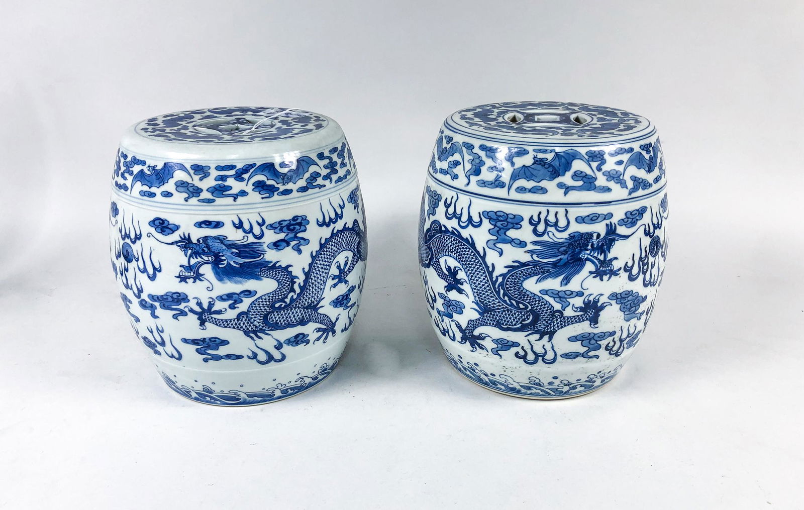 Pair Chinese Blue White Porcelain Drums: Pair of Chinese blue and white drums, decorated with dragons and beasts. 9inch H, 7.5inch W (each).