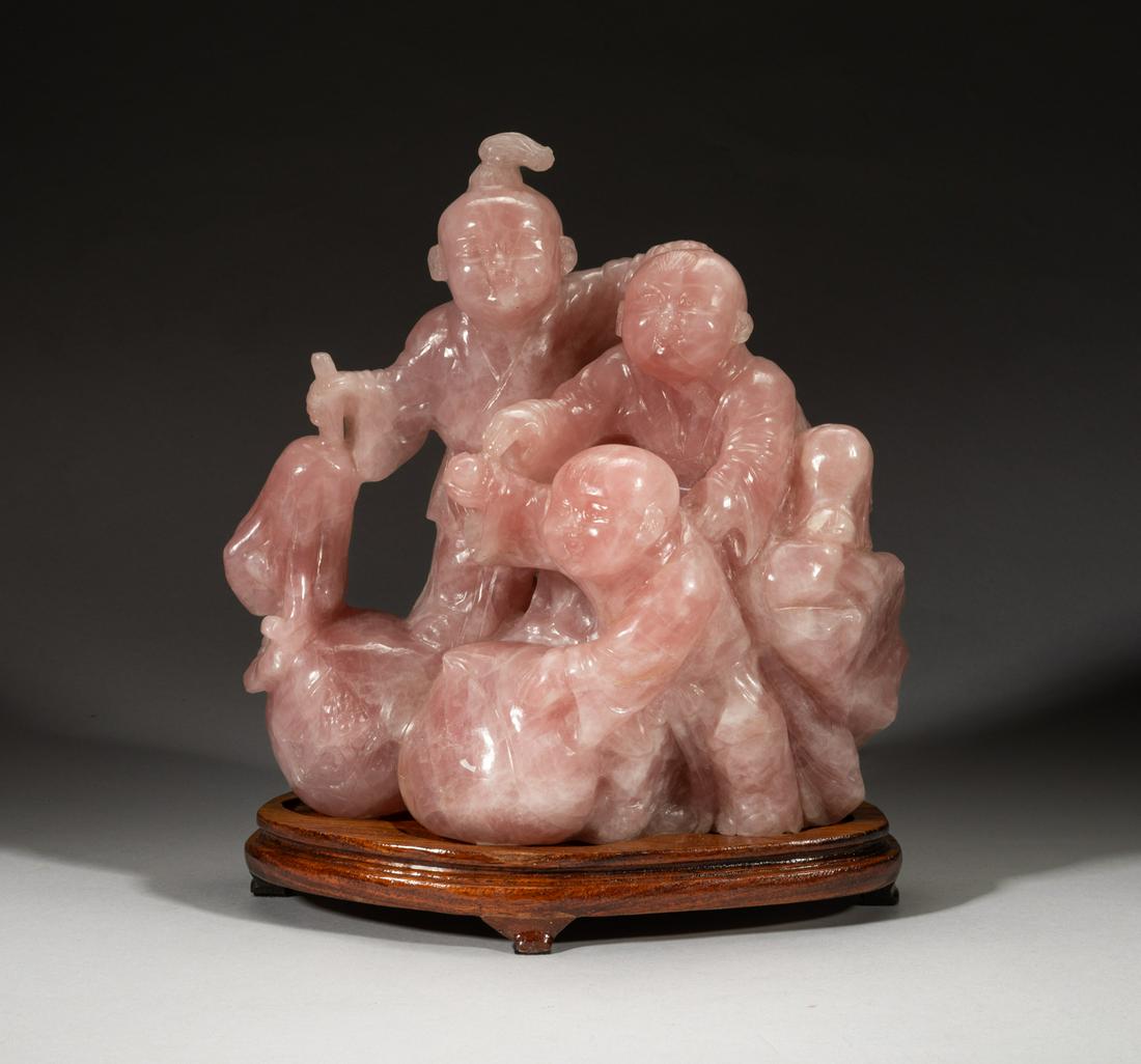 Antique Large Chinese Rose Quartz Sculpture: Deftly carved as three boys standing on craggy rocks with hands grasping buddha hand and peaches, rose quartz is a type of quartz which exhibits a pale pink to rose red hue, the color is usually due t