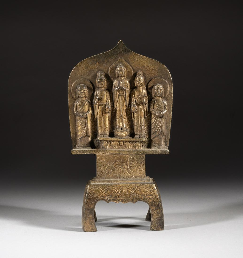 Rare Korean Gilt Metal Buddha: The pointed panel supported on a rectangular stand, cast with five standing Buddha, all dressed in low flowing robes, the central Buddha with hands in anjalimudra, the Buddha beside him with hands in 