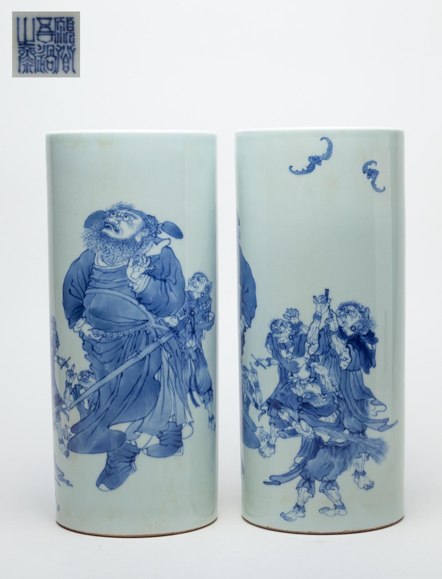 Pair Chinese Export Porcelain Vases: Both of cylindrical form, the exterior painted with a general looking at a pair of bats with his servants around, inscribed with related passages, the bottom marked with six characters. 5inch W, 11.5i