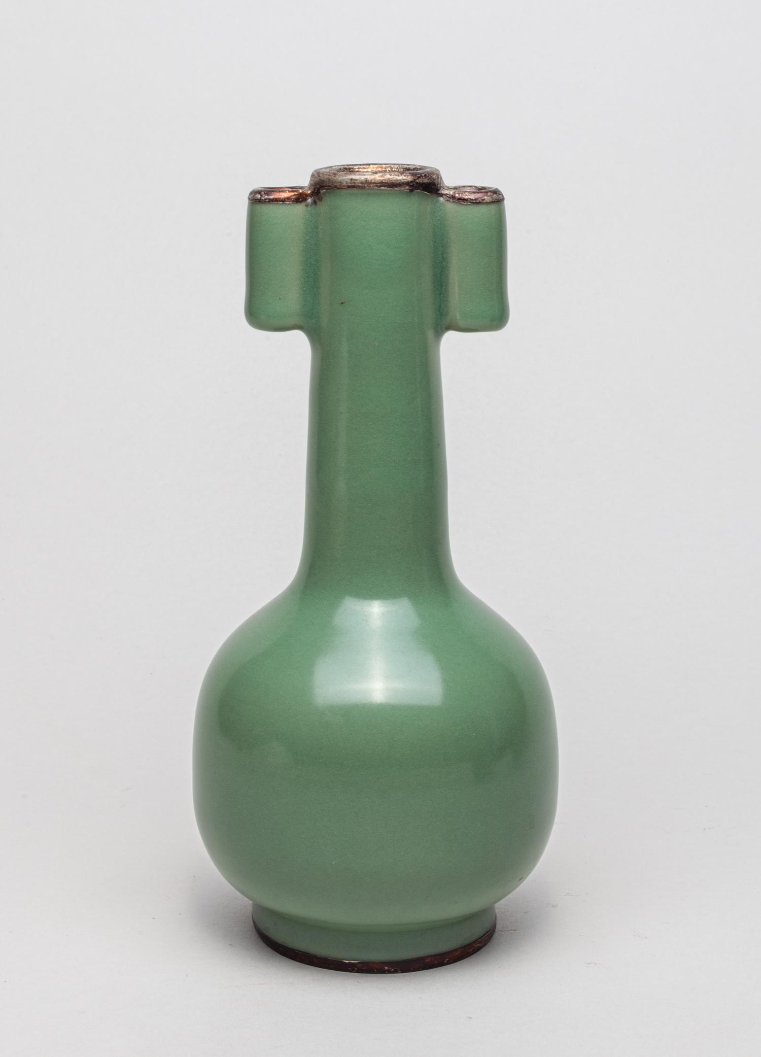 Chinese Longquan Ware Porcelain Cabinet Vase: The globular body rising from a short foot to a tall slender neck set with a pair of tubular handles, overall applied with an even celadon green glaze. 8.3inch H, 3.9inch W. The estate of DTLA antique