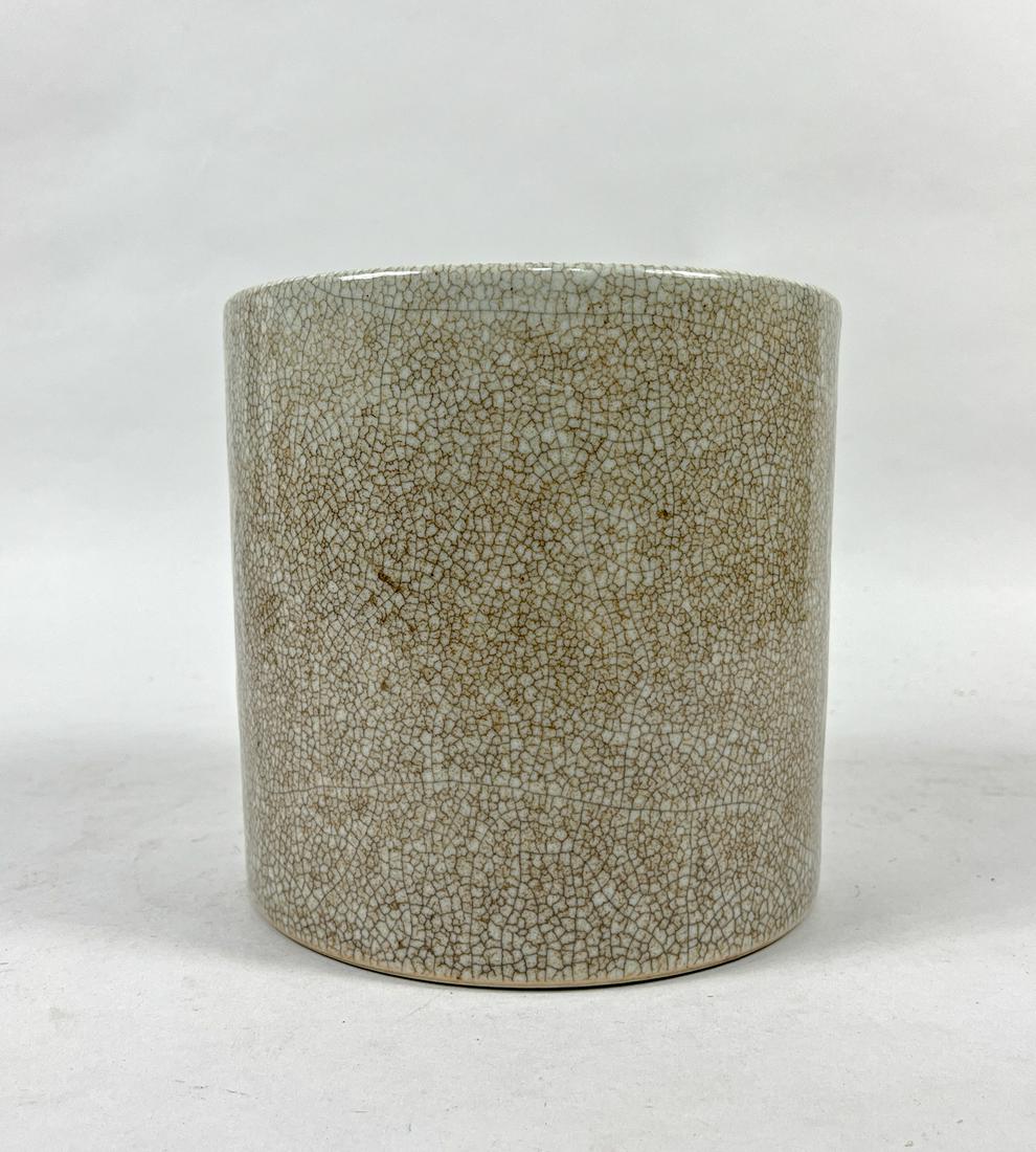 Large Chinese Ge Type Porcelain Brush Pot: Of cylindrical form, covered overall with a creamy glaze suffused with a matrix of brown crackles. 7inch H, 7.4inch W.