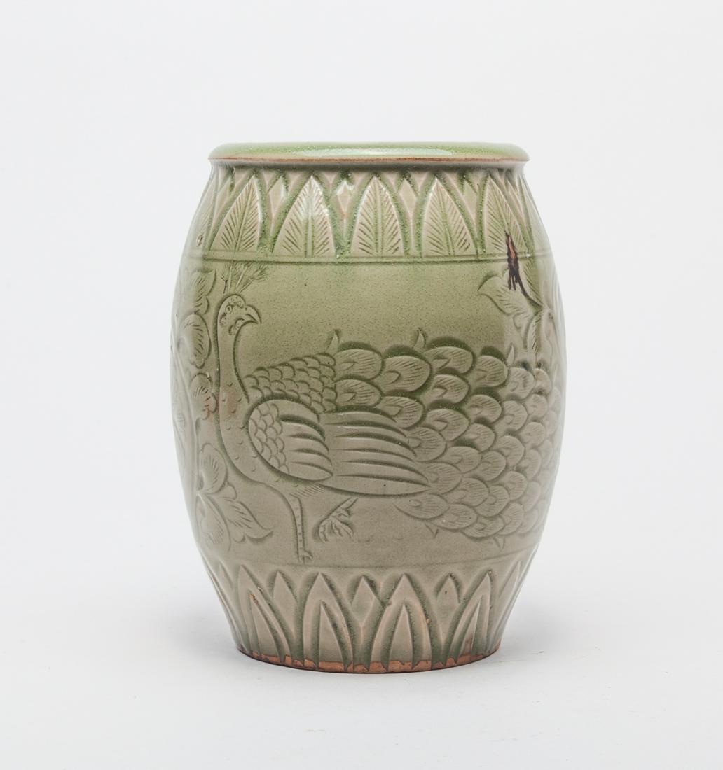 Chinese Yaochou Ware Porcelain Vase: Well potted in ovoid form, the exterior incised with a peacock and meandering leafy lotus sprays, between bands of overlapping leaves, covered in an olive-green glaze pooling to a deeper tone in the r