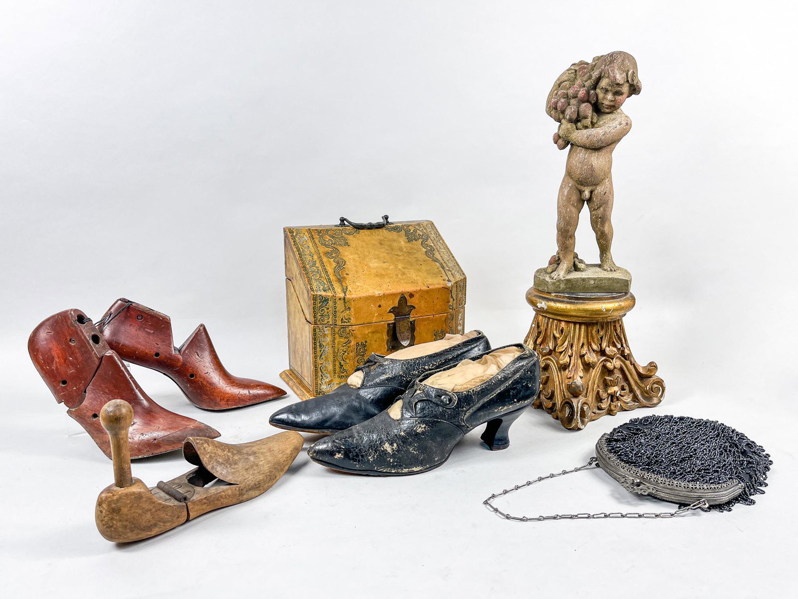 English Victoria Type Pieces: Including five vintage English type wood shoes, a table sculpture as a boy holding fruits, a beaded clutch handbag, a golden-colored wood stand, a wood brochure rack. 9.5inch H, 10.2inch L, 6.5inch W