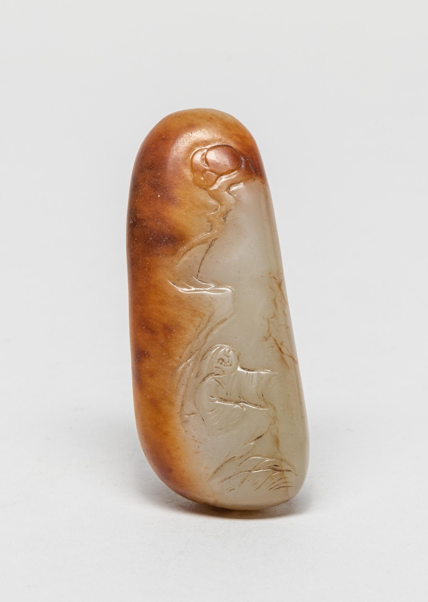 Chinese Russet Jade Toggle: The well-smoothed russet jade carved to one side with a scholar and craggy rocks, the reverse with a tall lingzhi branch. 3inch L, 1.25inch W.