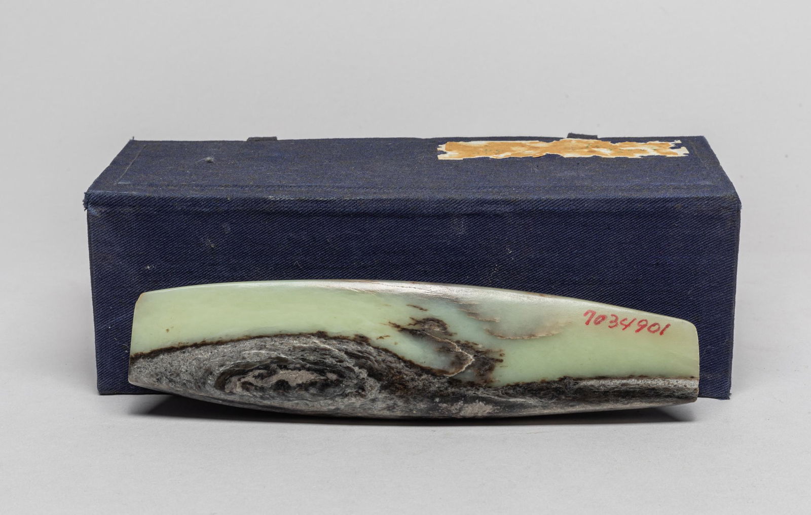 Old Large Chinese Jade Spear Point: Collectible elongated jade spear point, the stone in a pale celadon color with black and brown inclusions, with a box. 6.8inch L, 1.7inch W.