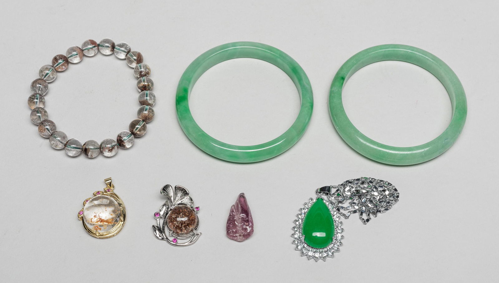 Collectible Chinese Bangles/Tourmaline/Stone: Including two bangles, a crystal bead bracelet, a tourmaline toggle carved with lingzhi and fruit, two crystal pendants, a green-colored stone with a silver-colored chain necklace. 2.82inch outer diam