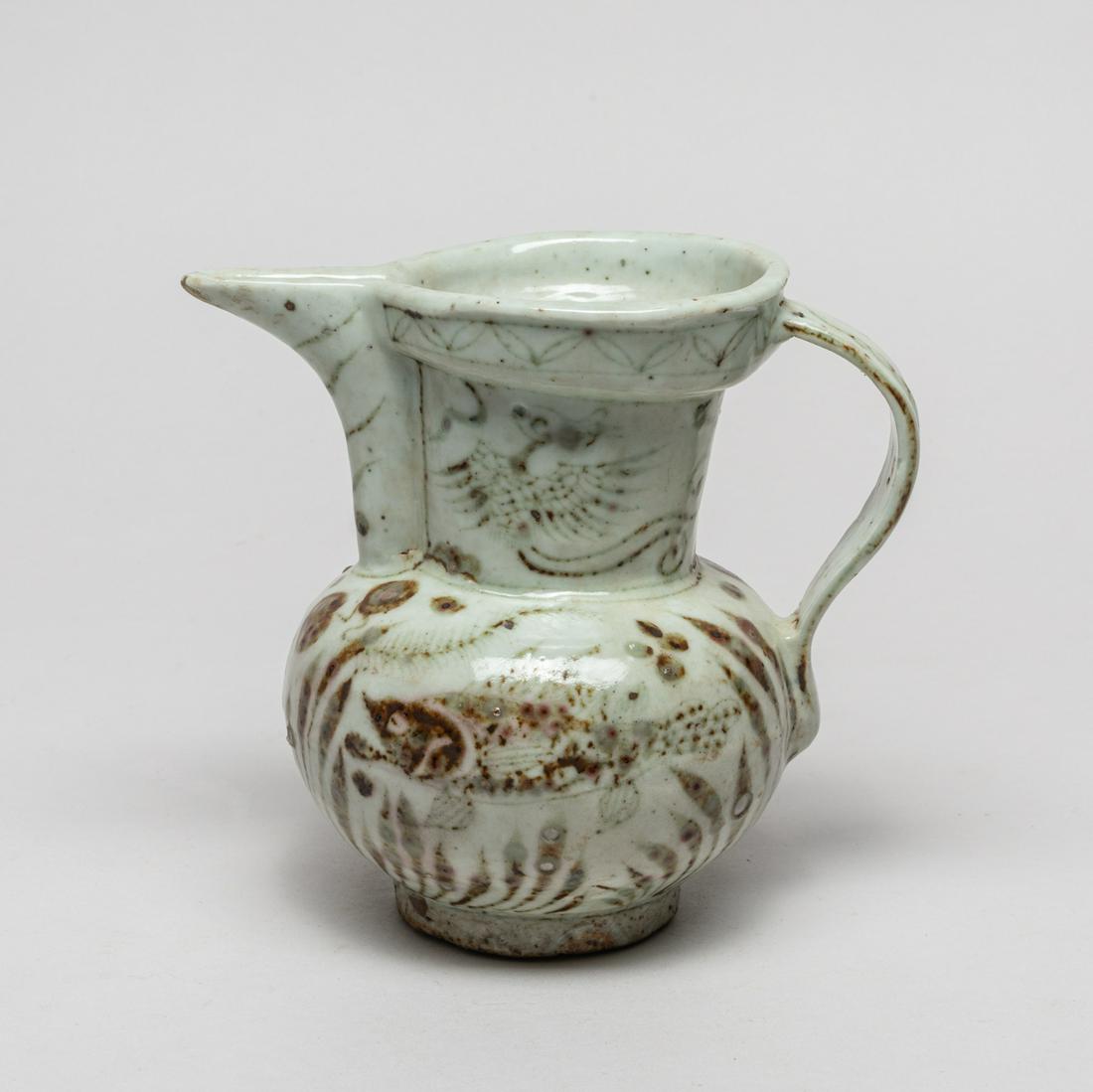 Rare Korean Copper Red Porcelain Pot: The globular body rising from a short foot to a broad neck with everted mouth and pronounced spout, the exterior painted with fish swimming among water plants beneath a pair of phoenixes. 5.6inch H, 6
