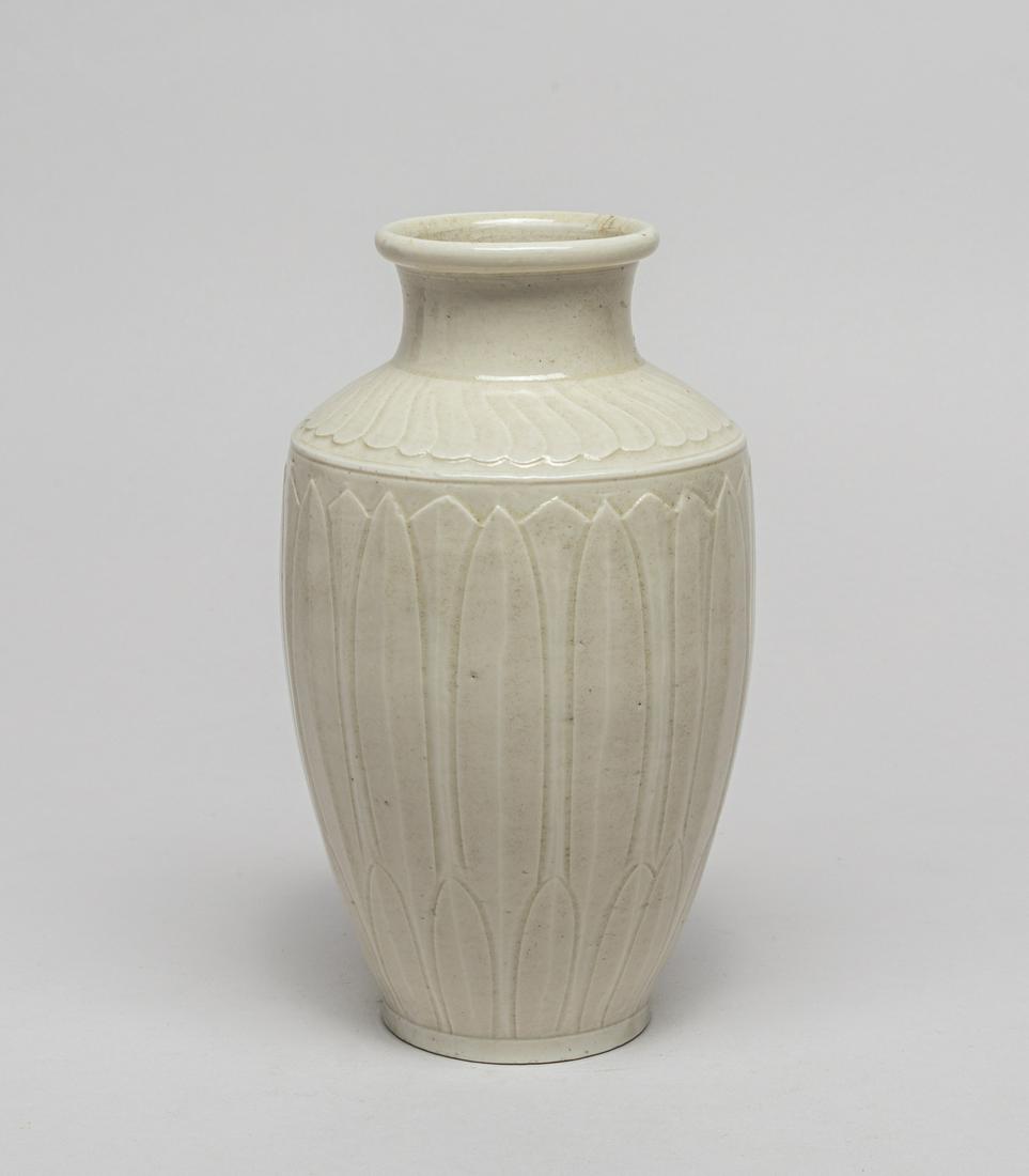 Rare Chinese Ding Ware Porcelain Lotus Vase: The baluster body rising to an angled shoulder and a waisted neck, the body and neck carved with overlapping lotus petals resembling lotus bloom, covered overall with a creamy white glaze. 7.5inch H, 